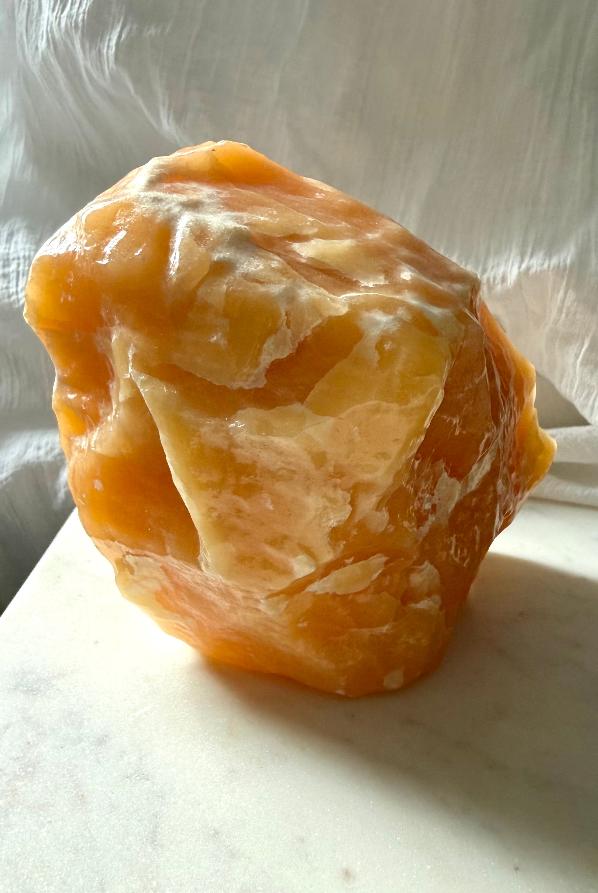 Large Orange Calcite statement piece from Mexico with rich orange color and dramatic natural mineral formations