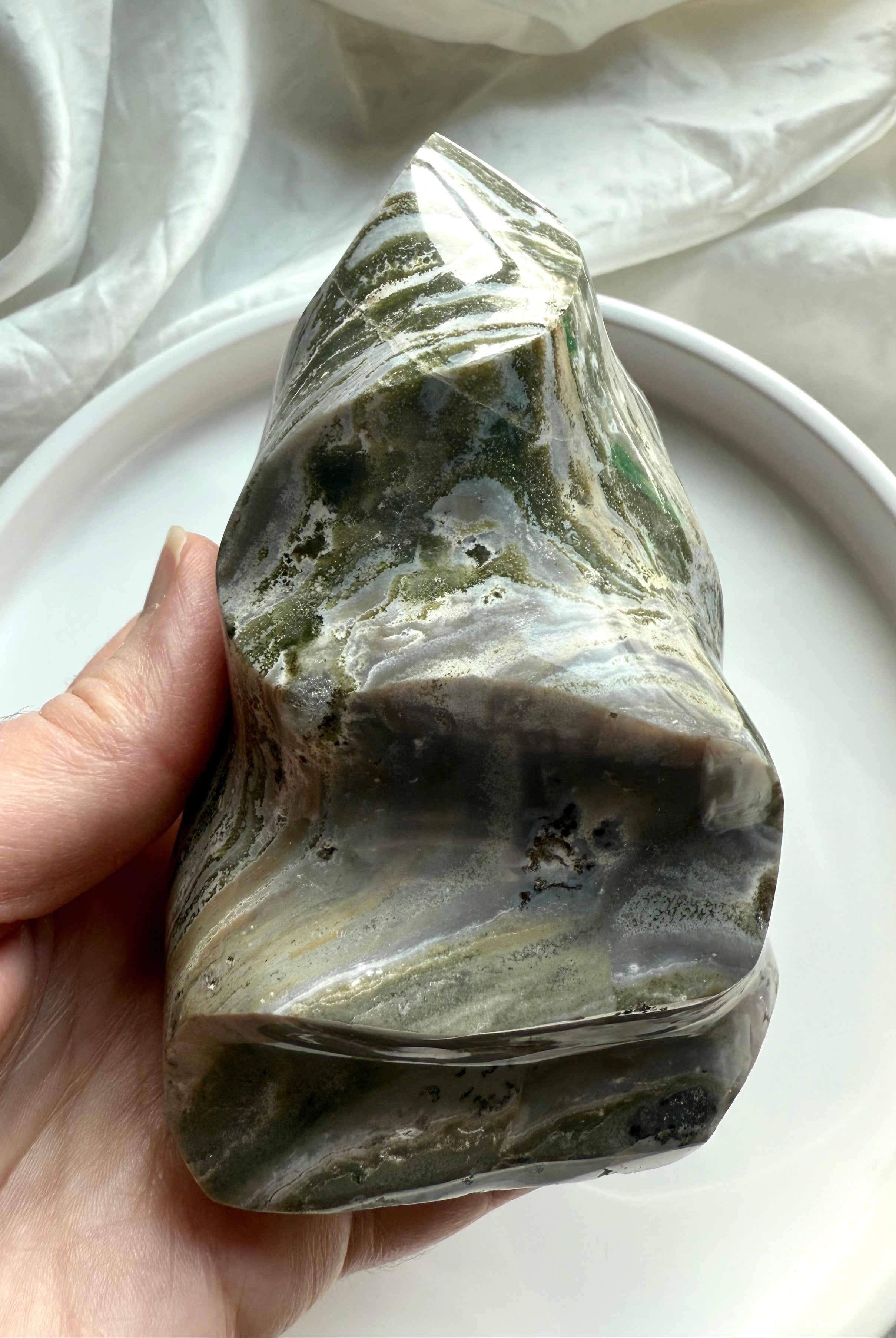 Green Ocean Jasper flame showing layered crystal patterns and earthy tones, polished into an organic sculptural form.