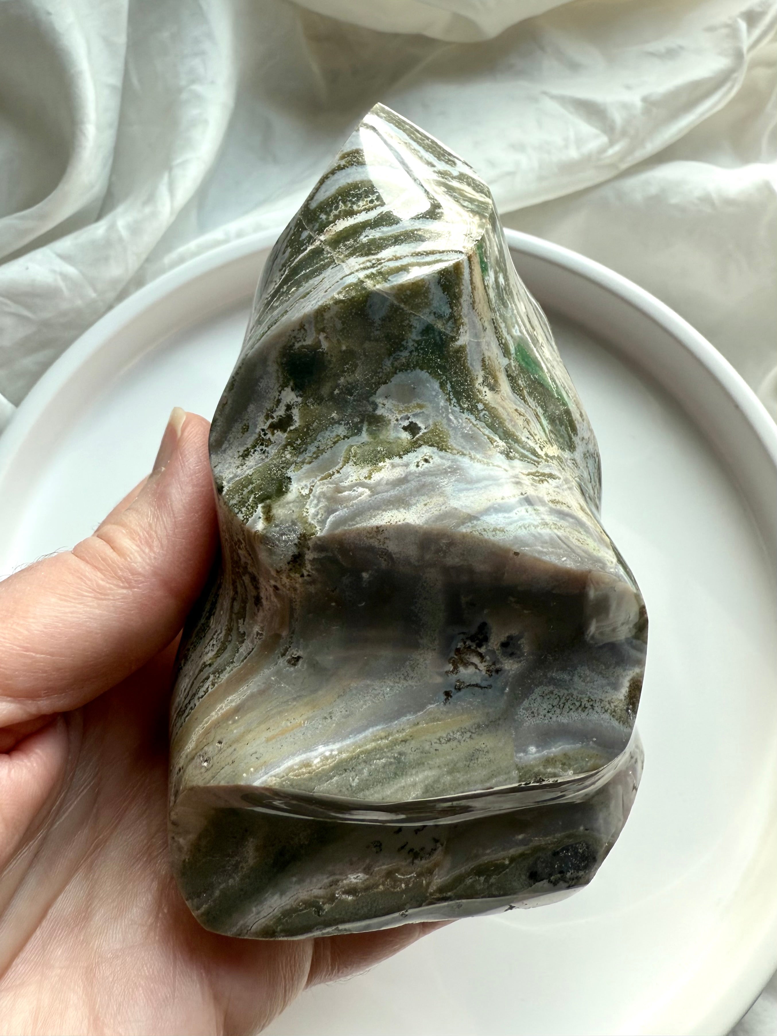 Green Ocean Jasper flame showing layered crystal patterns and earthy tones, polished into an organic sculptural form.