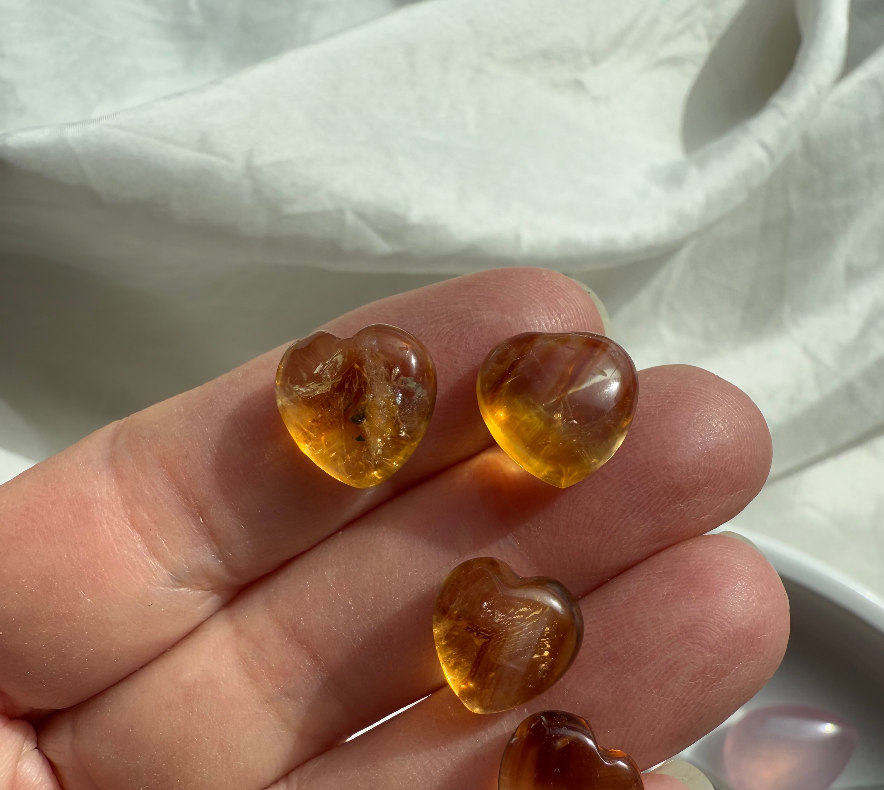 Mini Citrine Hearts shown on my hand for scale