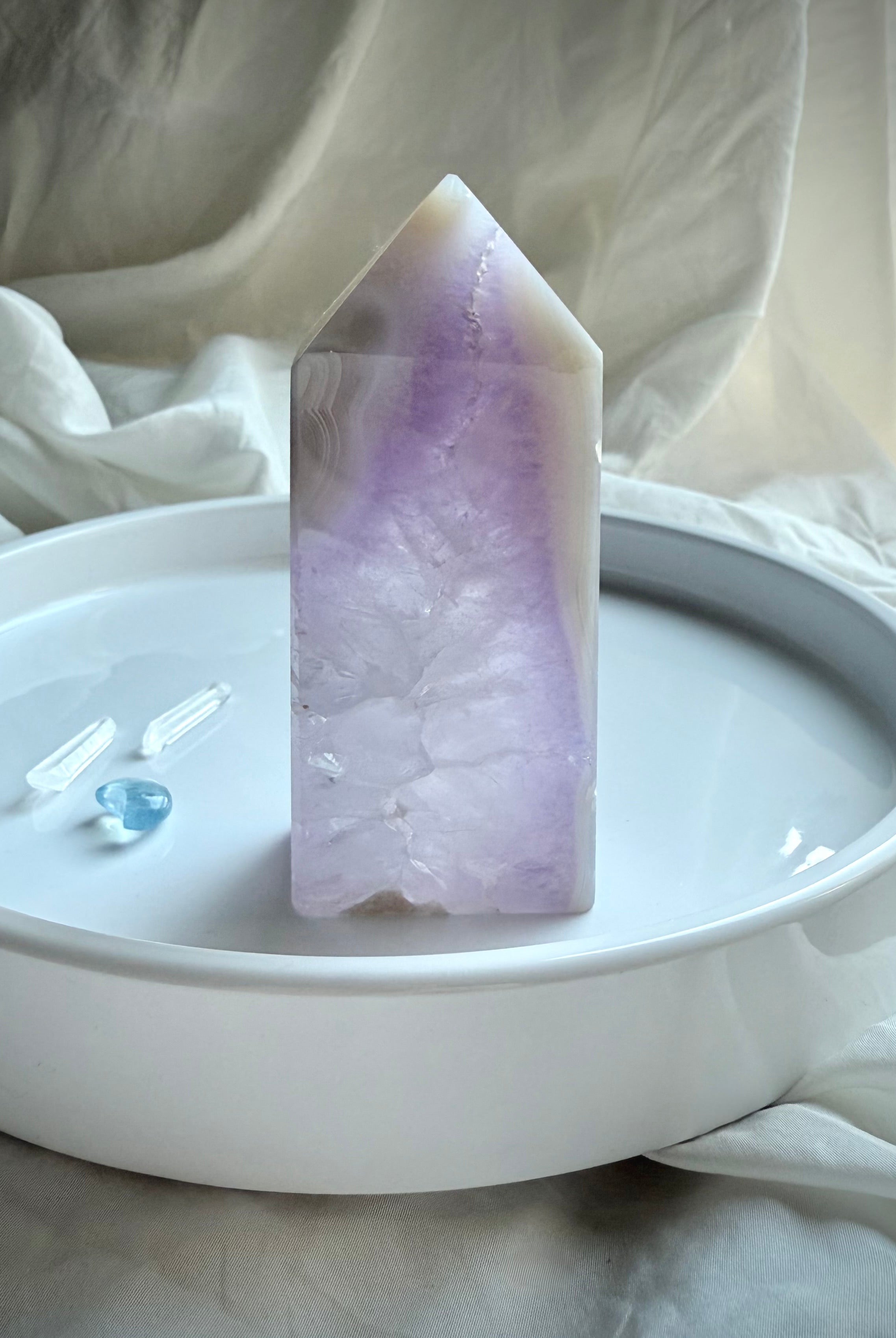 Polished Amethyst Geode Tower with white agate edge displayed on white ceramic tray