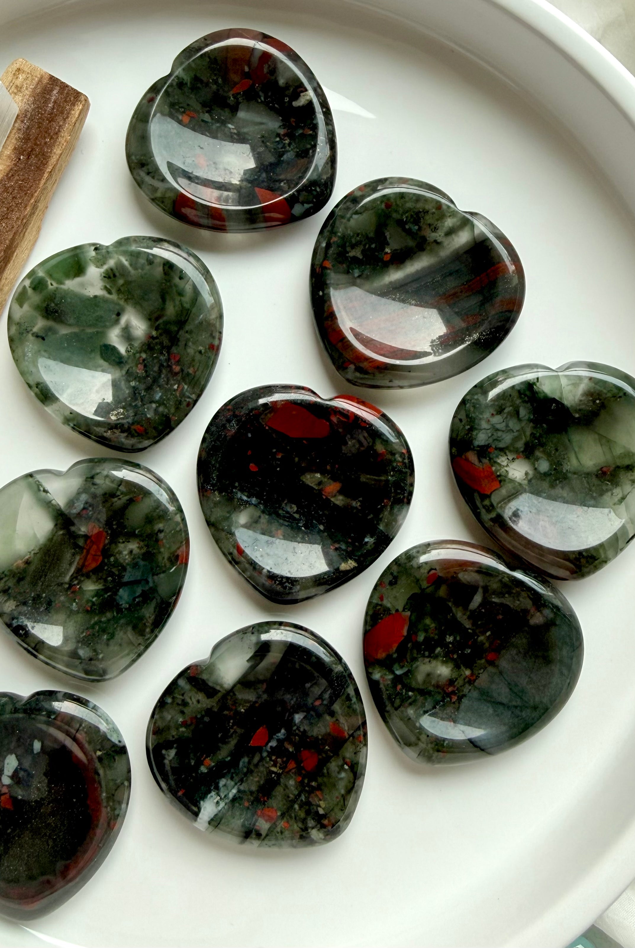 bloodstone heart crystal assortment with natural inclusions and polished shine, grounding stones for stress relief courage and protection