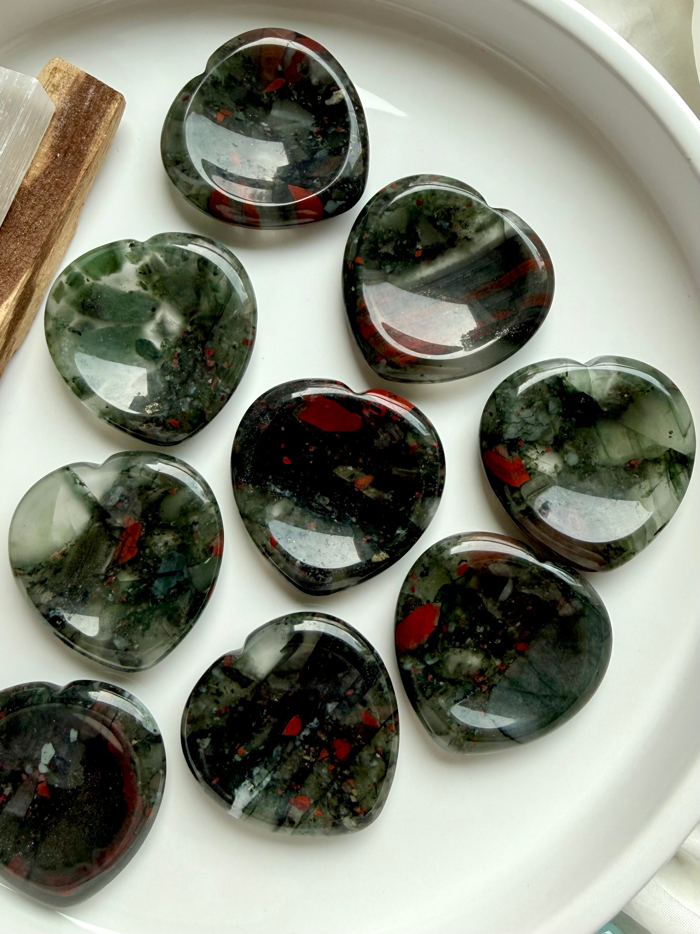bloodstone heart crystal assortment with natural inclusions and polished shine, grounding stones for stress relief courage and protection