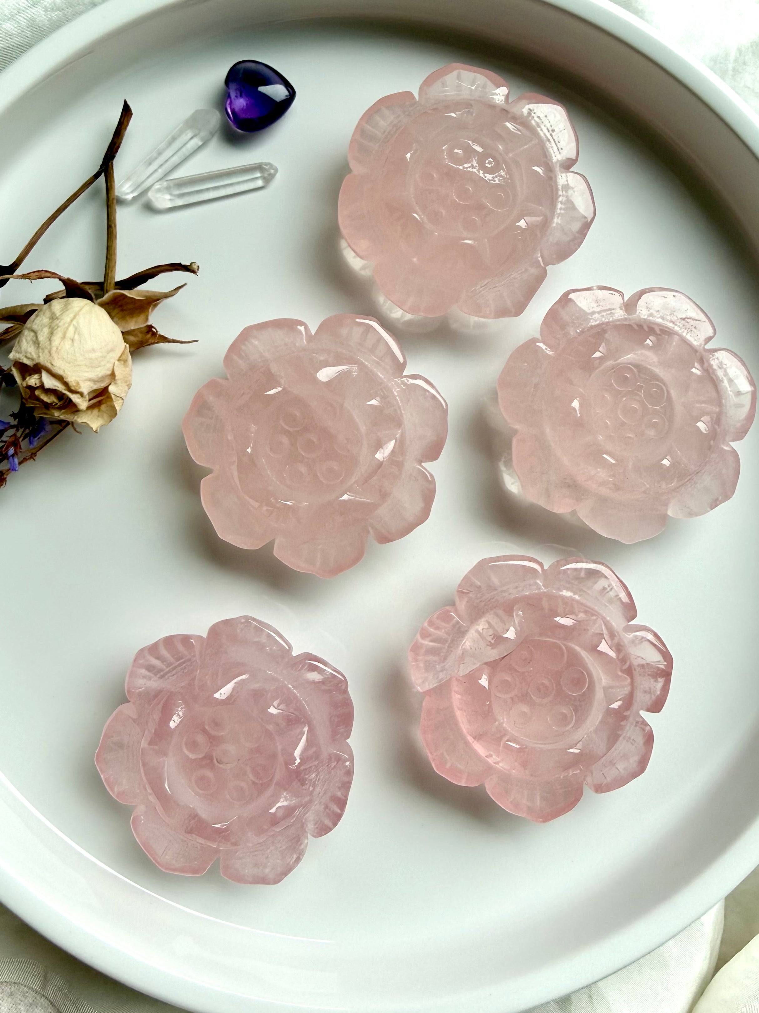 Rose Quartz Lotus Flower crystal carvings on white tray – hand-carved Heart Chakra stones for love, meditation and altar décor