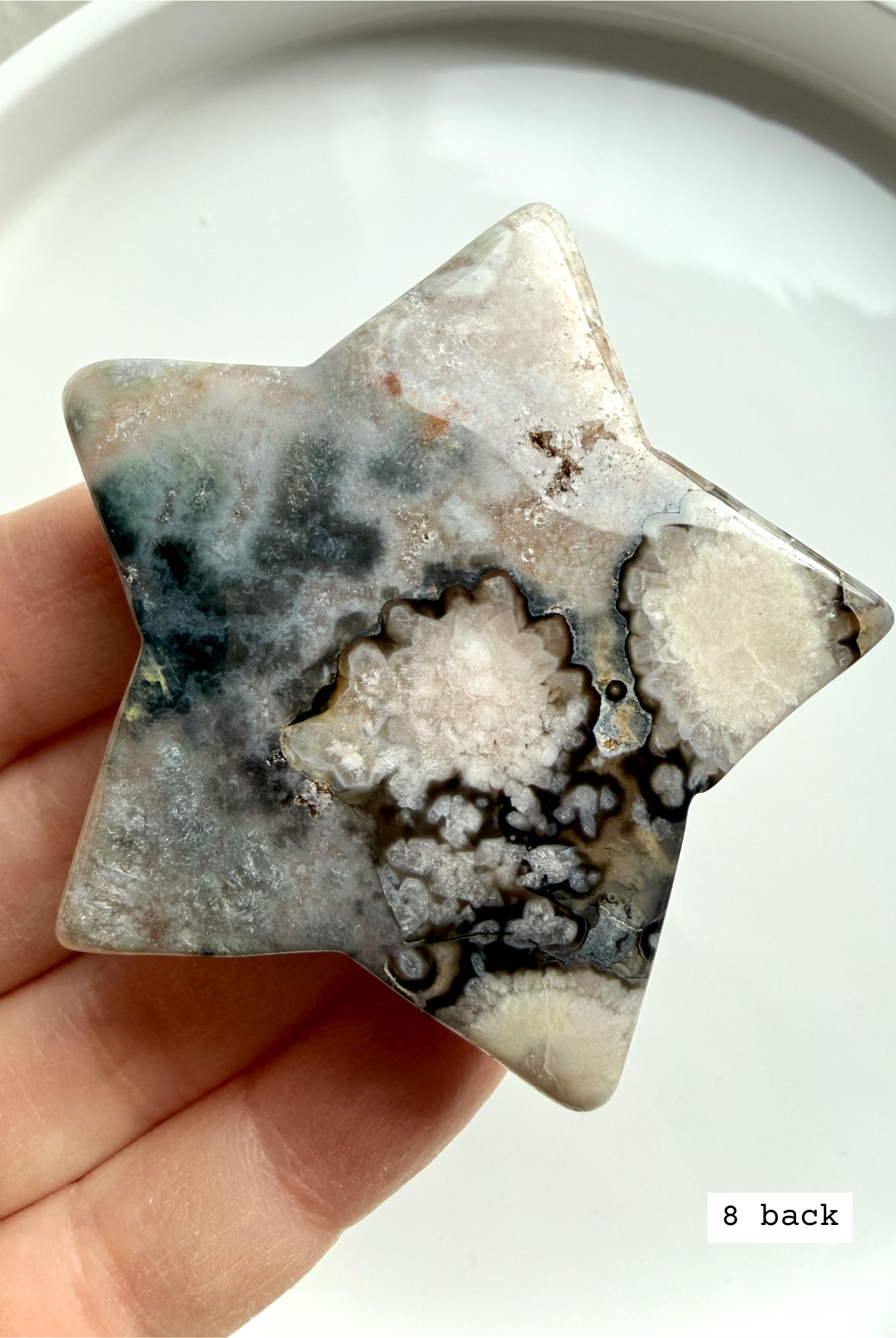 black flower agate star carving #8 front showing intricate floral plume patterns and high contrast tones