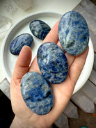 Meditate with a Sodalite Palm Stone, a Throat Chakra crystal of clear communication