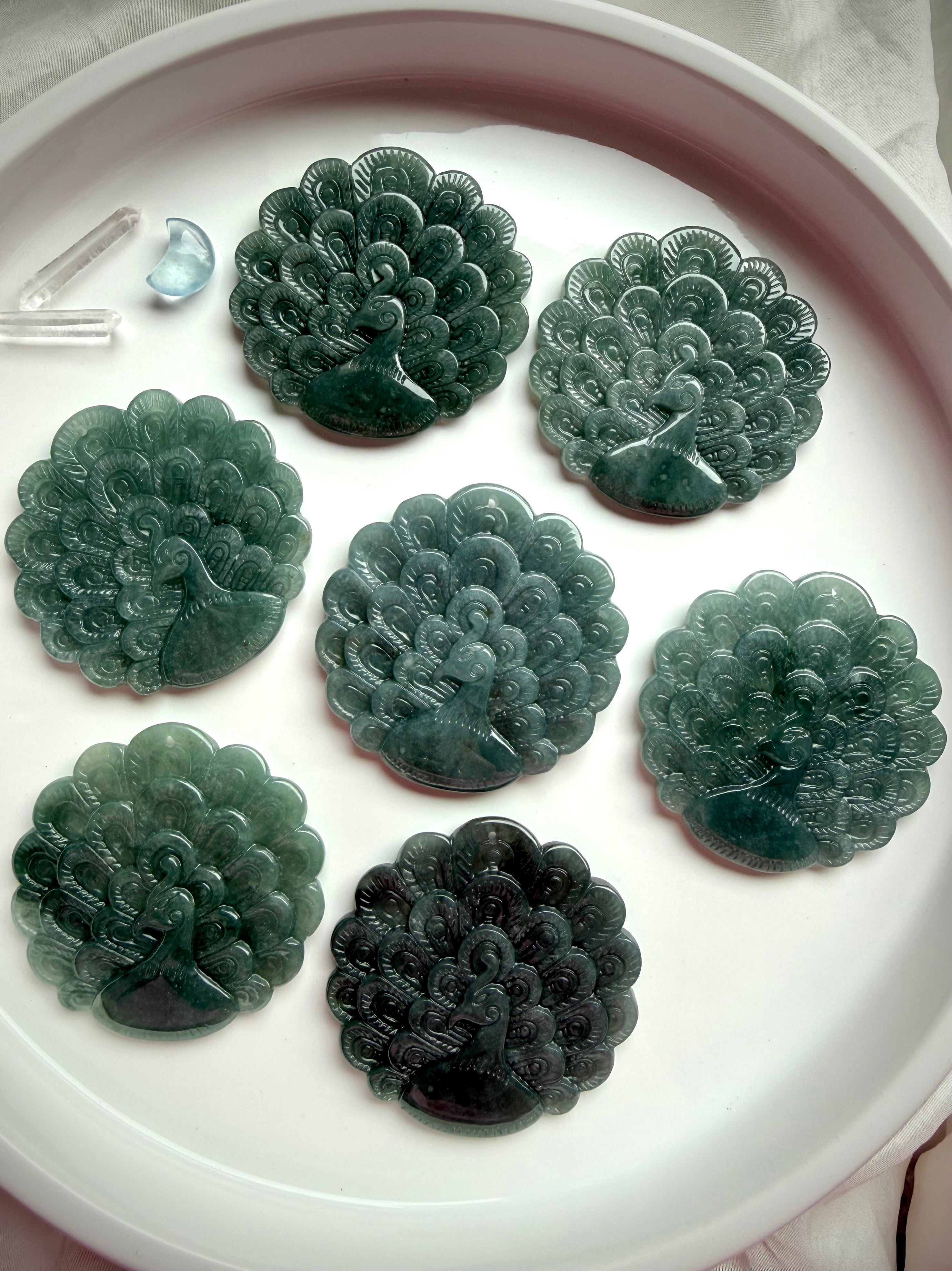 Collection of hand-carved Blue Water Jade peacock medallions in assorted natural tones
