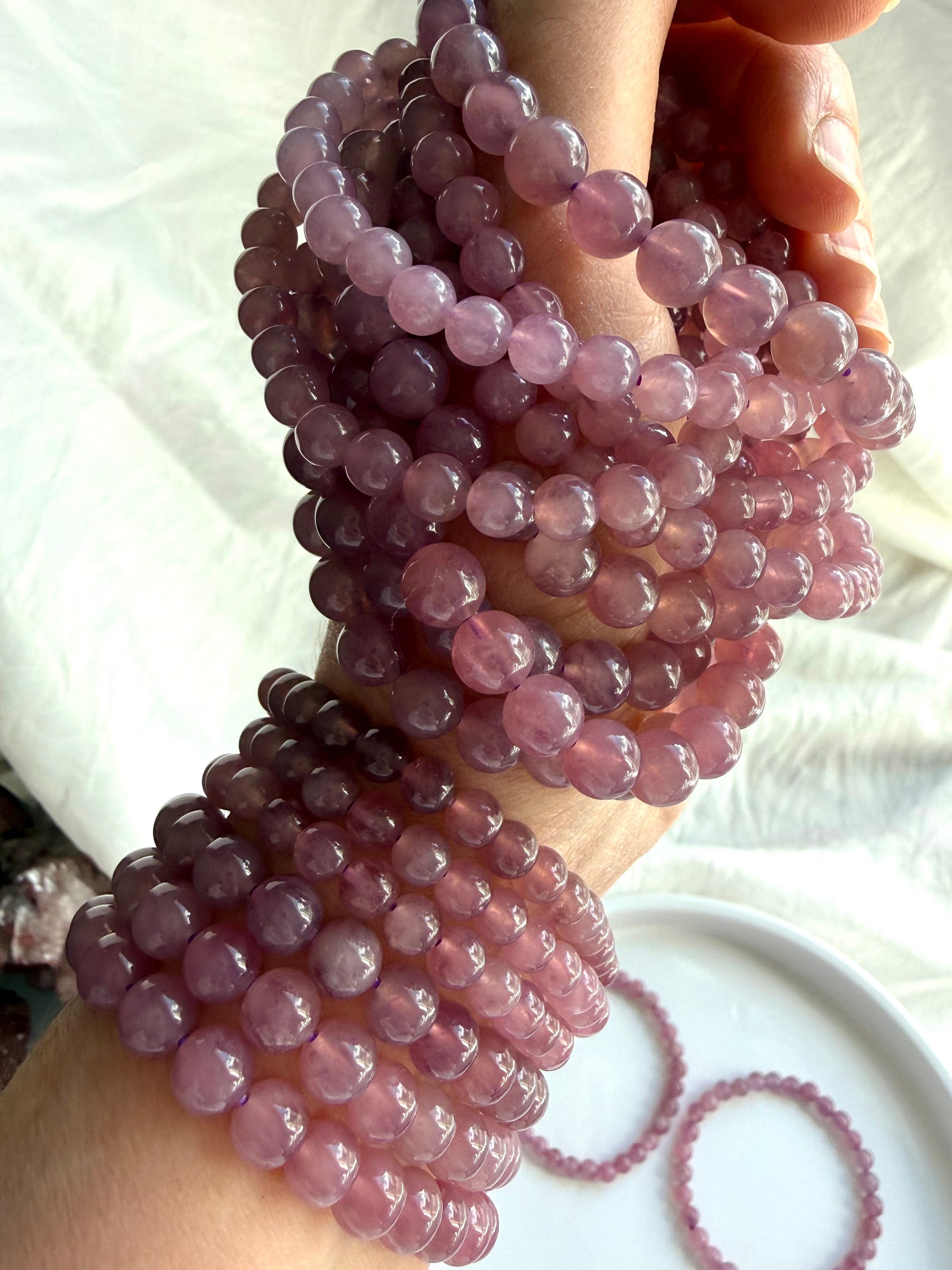 Lavender Rose Quartz gemstone bracelets featuring luminous pinkish-lavender beads with natural variation and inner glow