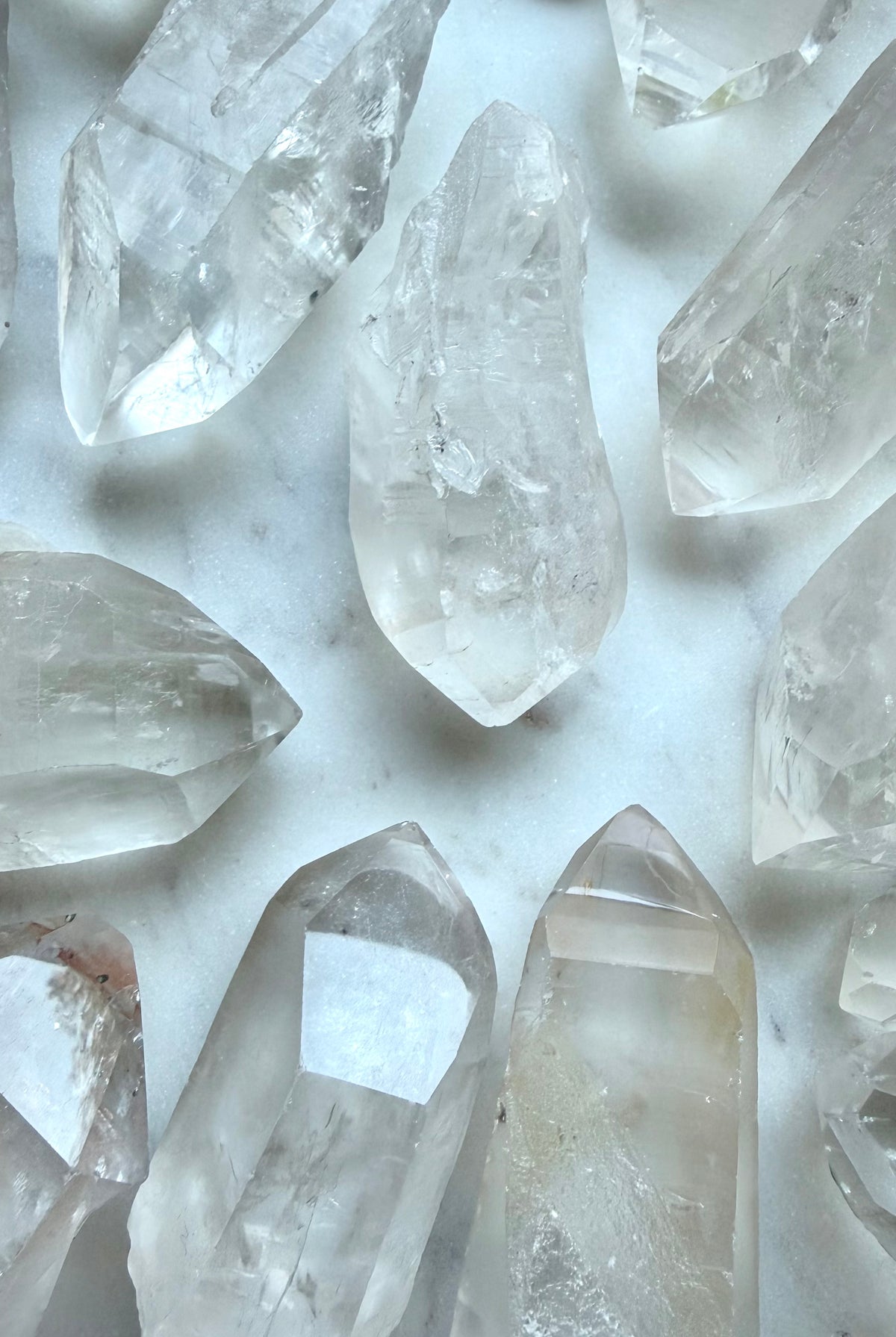 Rough Lemurian Quartz points from Brazil with natural ladder lines, varied terminations, and unique crystal formations