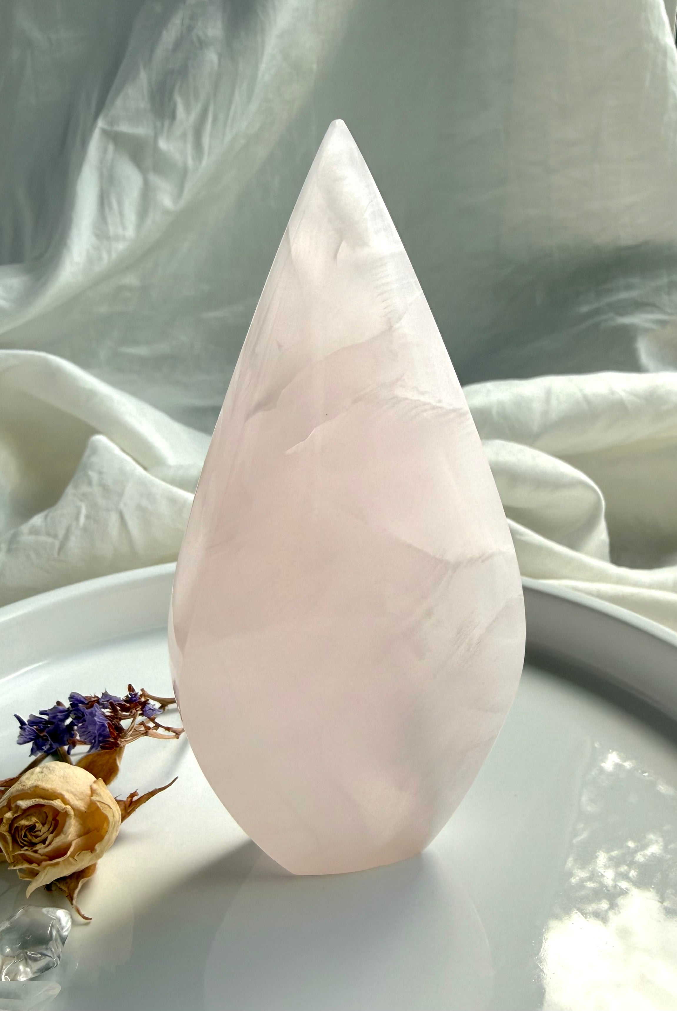 Pink Mangano Calcite flame from Pakistan with soothing pastel color and elegant polished teardrop shape