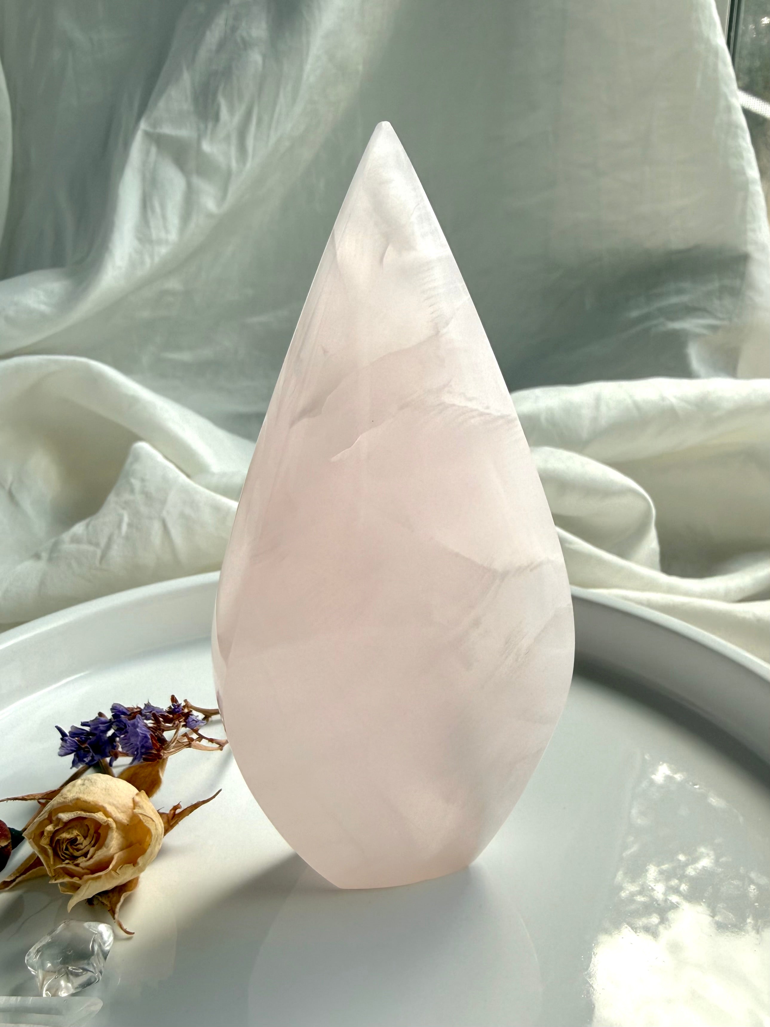 Pink Mangano Calcite flame from Pakistan with soothing pastel color and elegant polished teardrop shape