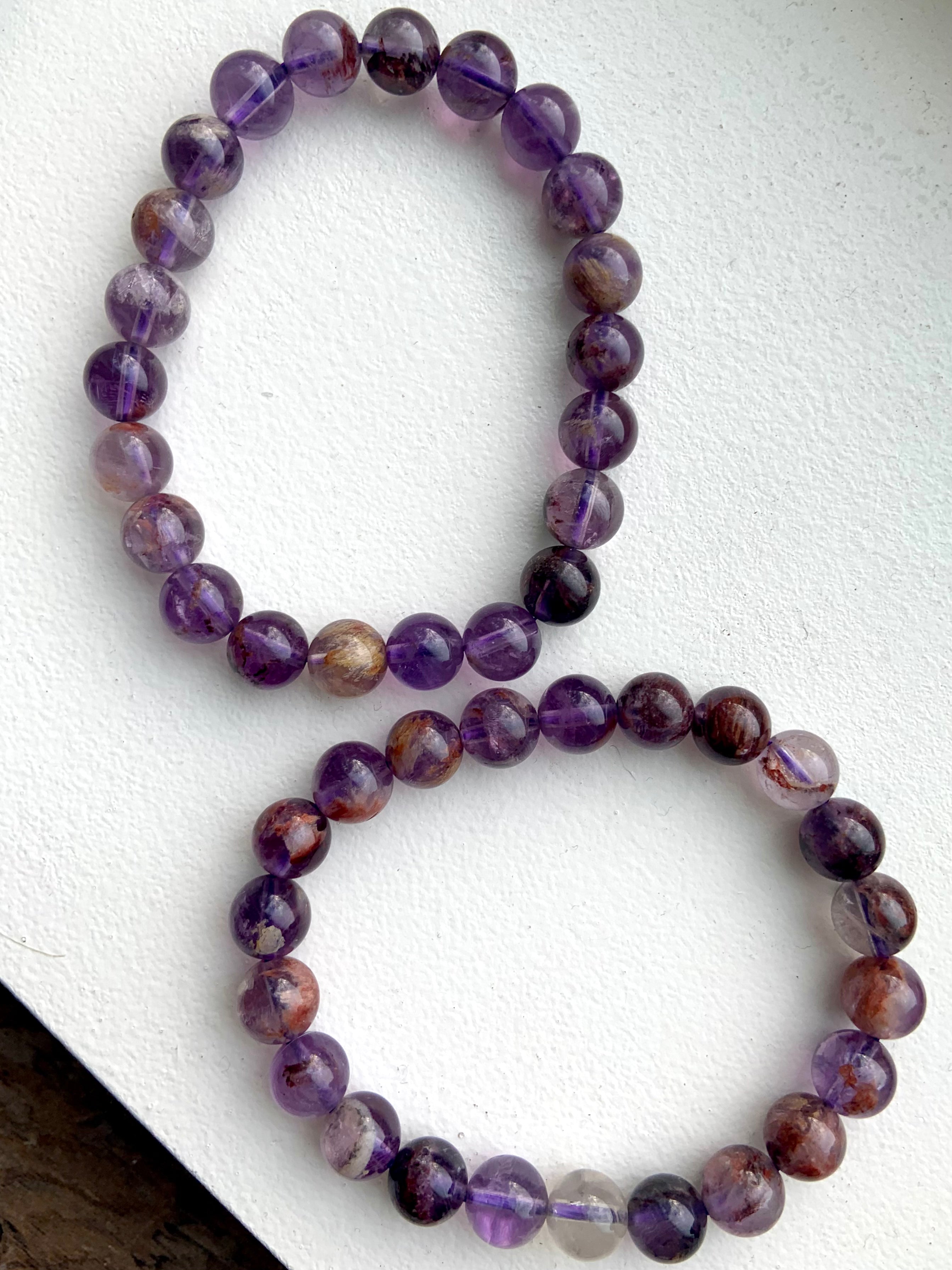 Super 7 Amethyst healing crystal bracelets for spiritual awakening and crown chakra alignment
