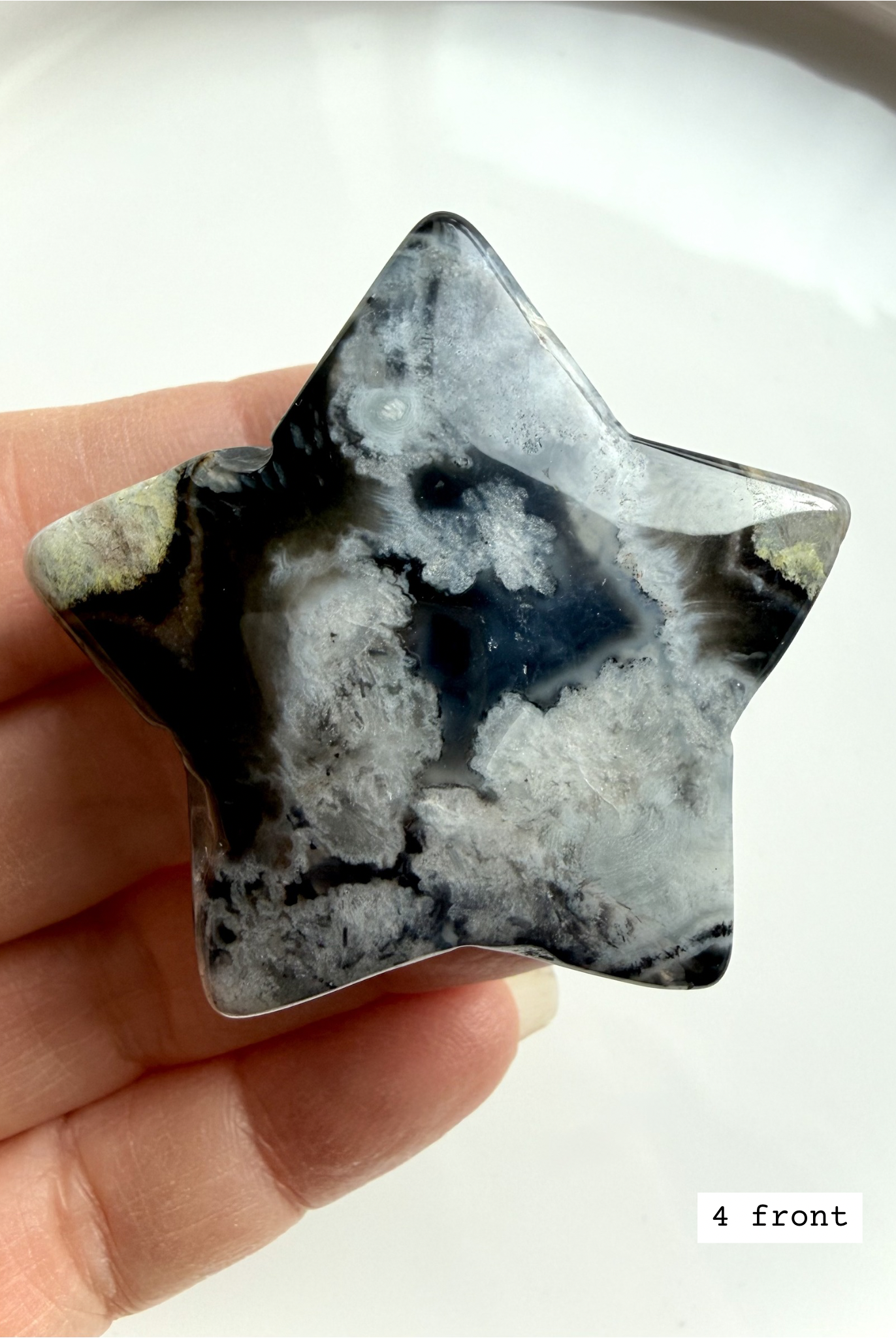 black flower agate star carving #4 front showing bold white flower inclusions and dark agate base