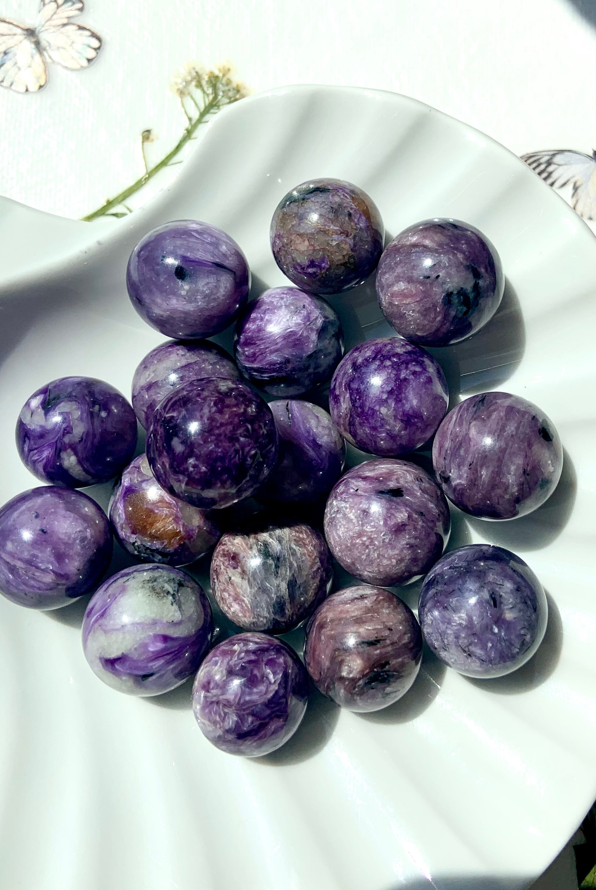 Purple Charoite mini spheres with beautiful shimmering patterns in the stone.