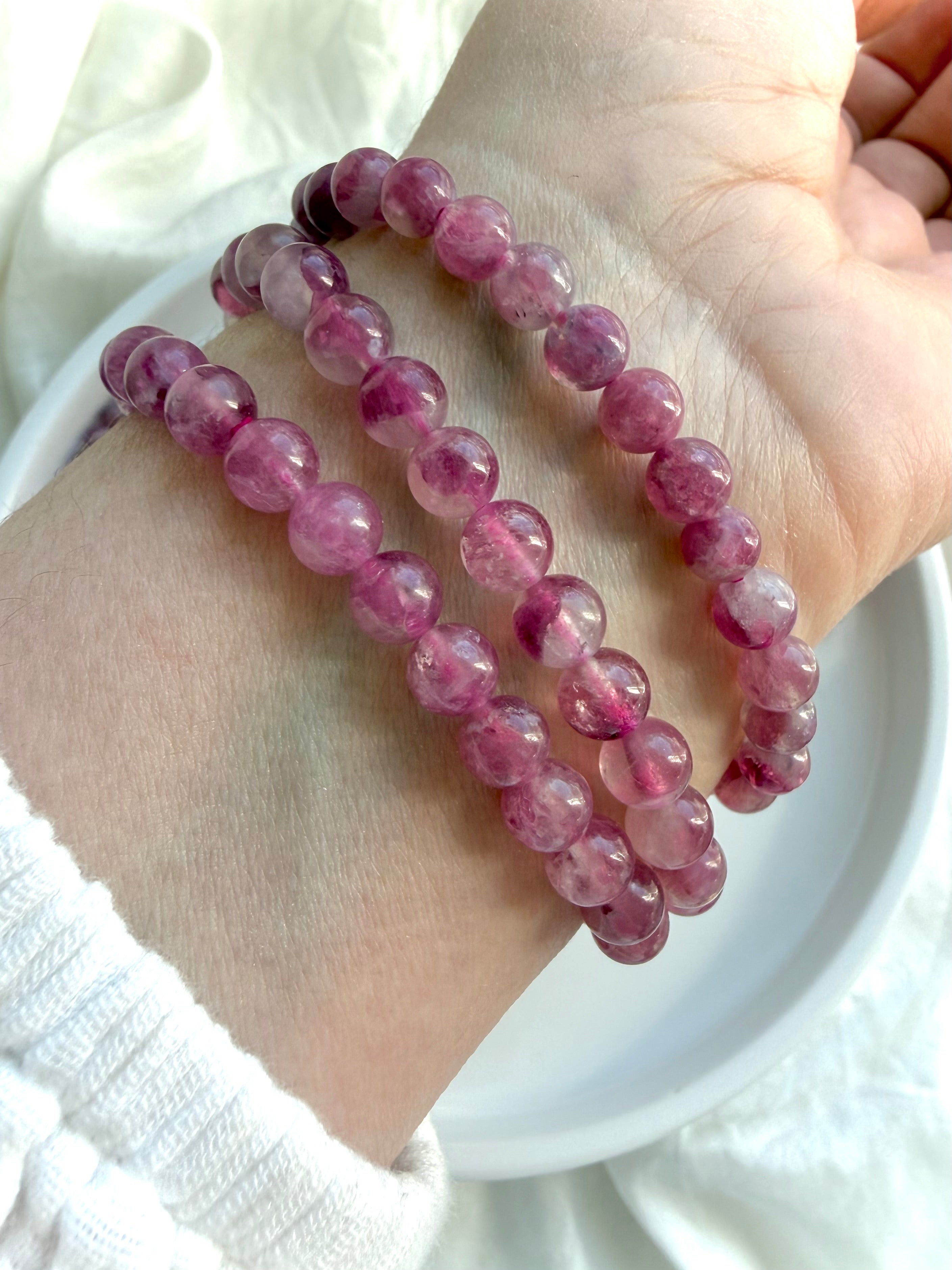 Stack of 3 Pink Tourmaline crystal bracelets featuring translucent pink gemstone beads for October birthstone jewelry and Heart Chakra healing