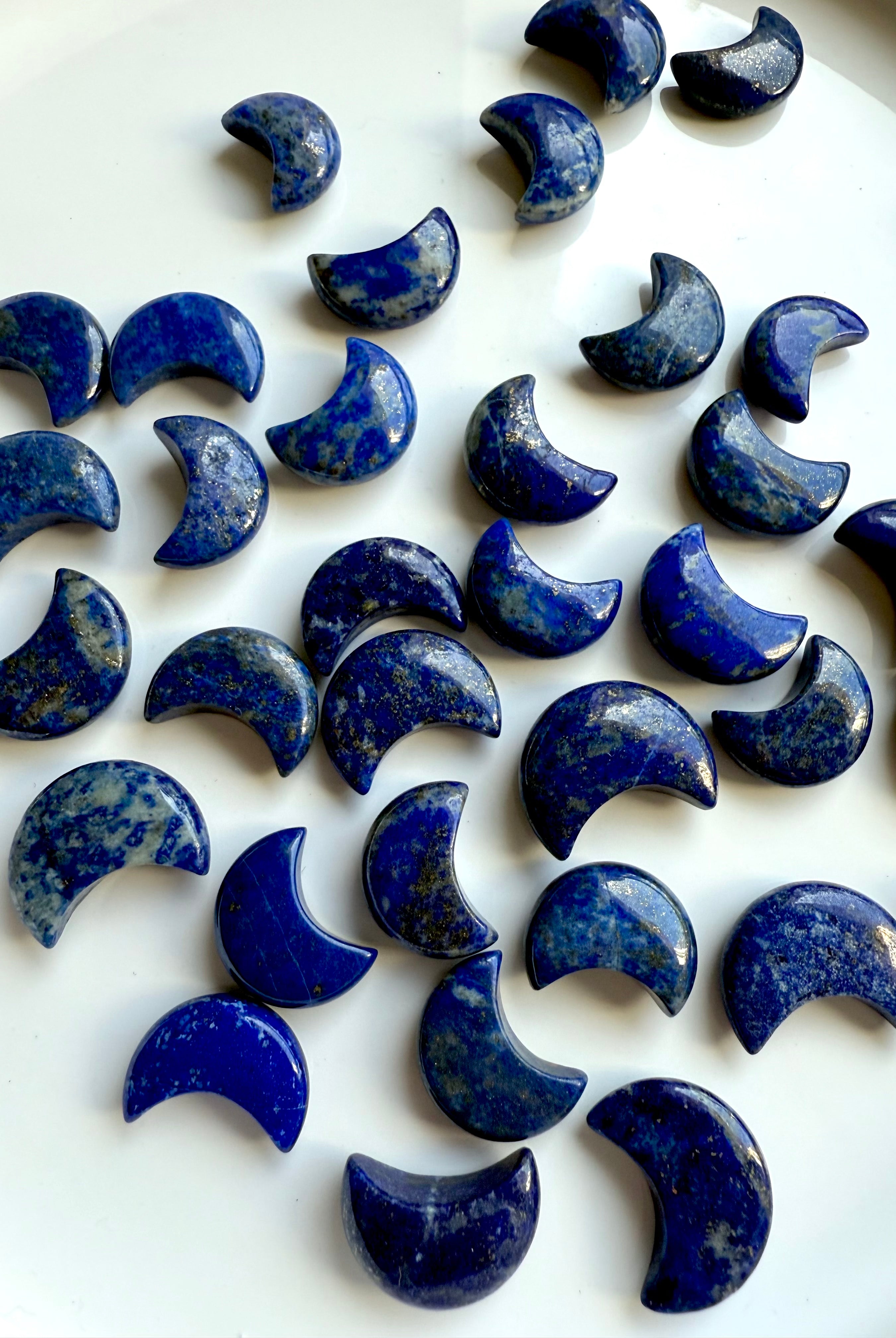 Lapis Lazuli crystal moons with glossy polish and celestial energy