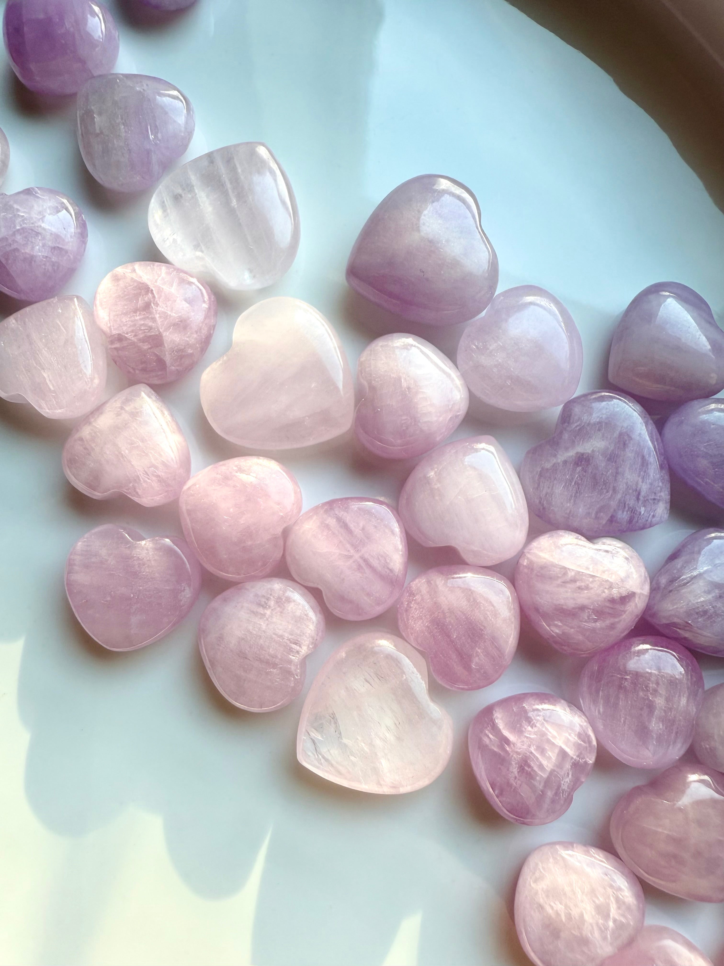 Mini Kunzite Hearts in soft pink and lilac tones β polished crystal hearts for love, calm and heart chakra healing