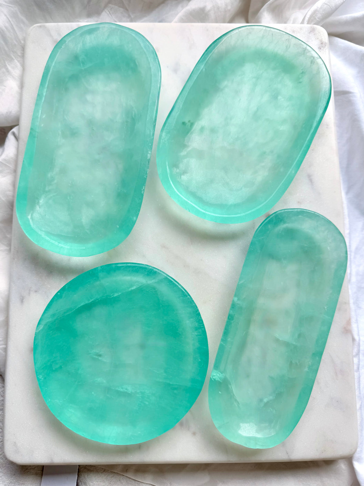 Green Fluorite crystal bowls with vibrant aqua-green color and polished translucent stone for clarity and renewal