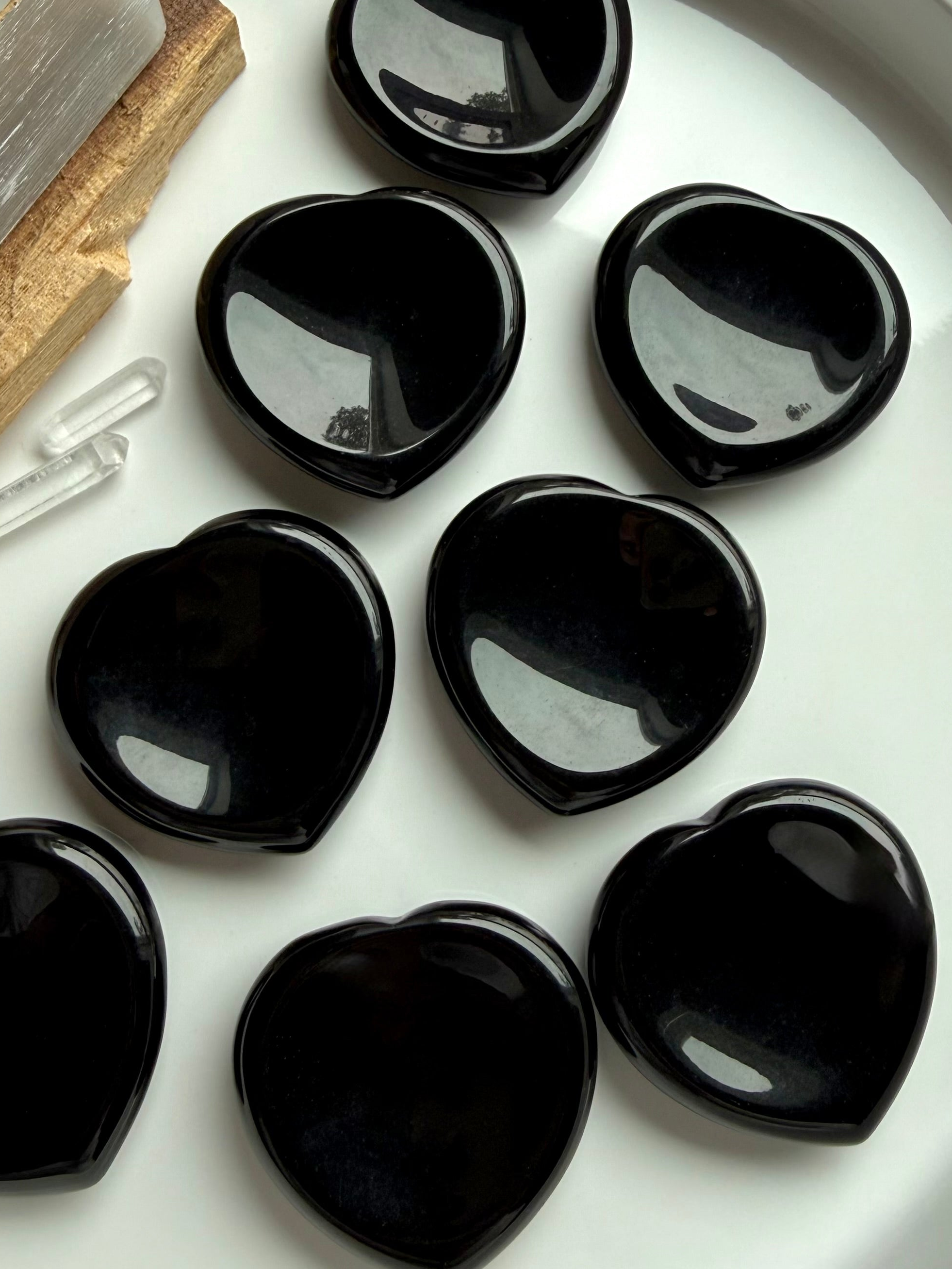 Polished black obsidian heart worry stones for anxiety and grounding