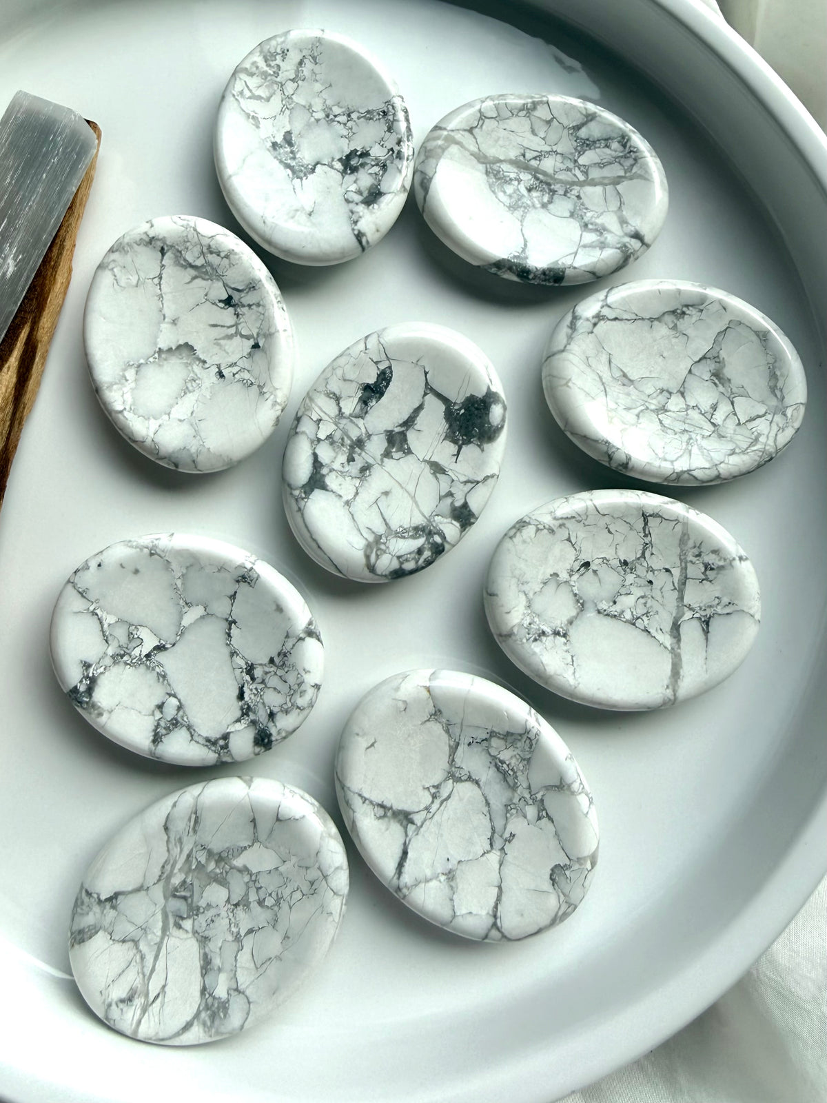 Howlite worry stones with natural white stone and distinctive gray marbled veining for calm and stress relief