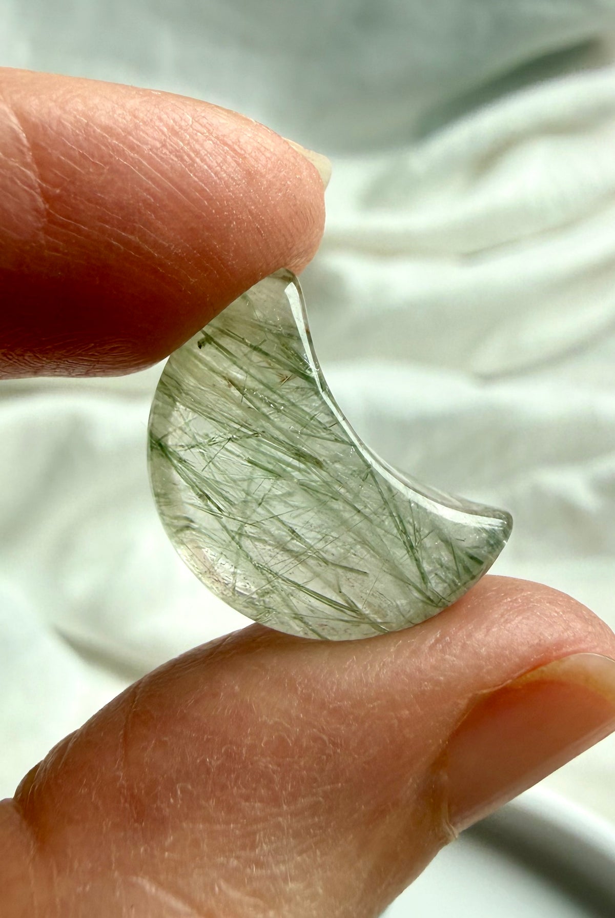 Mini Green Tourmaline in Quartz moons showing natural variations in inclusion density, clarity and green crystal patterns