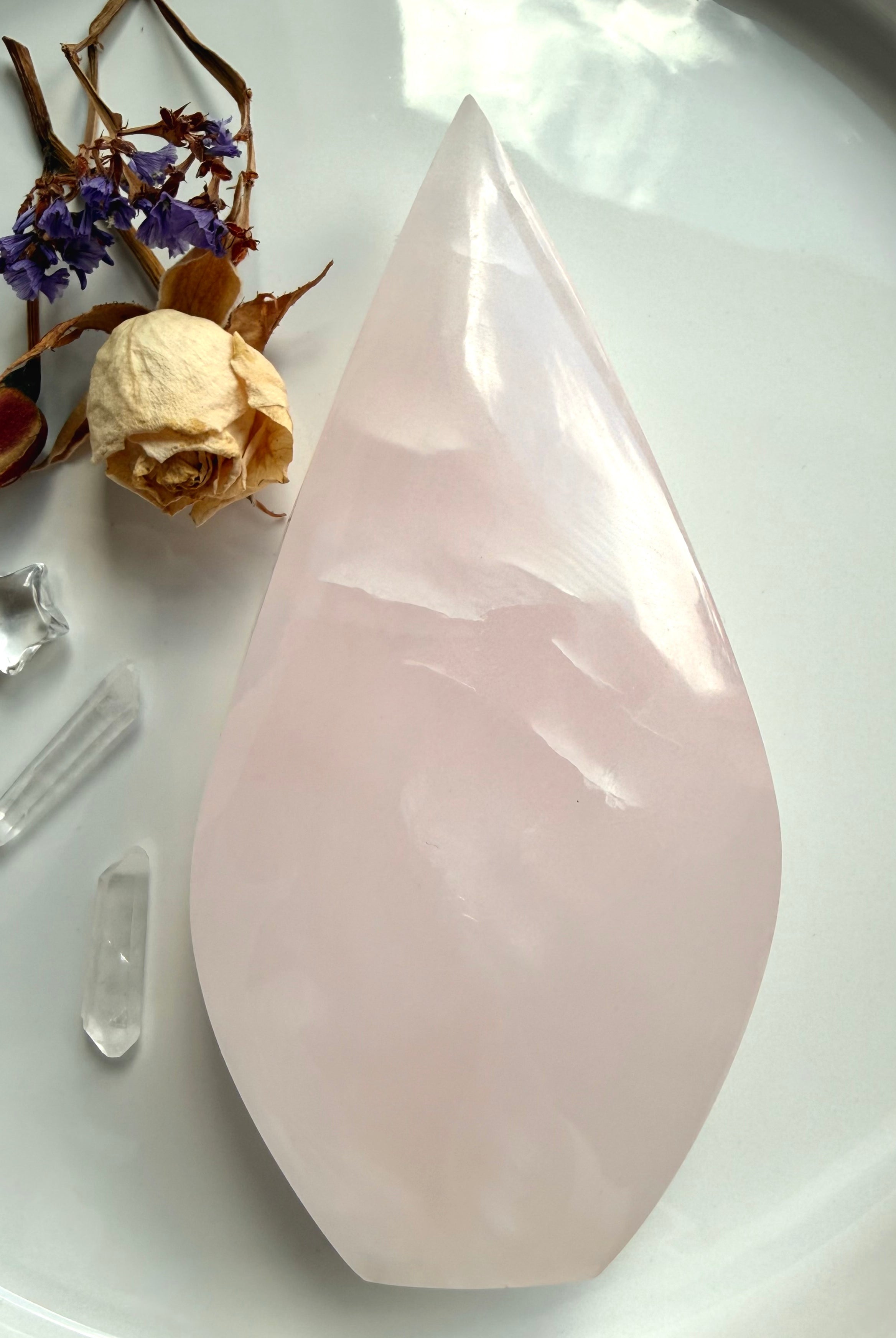Mangano Calcite flame carving with soft blush pink color and polished finish for emotional healing and heart chakra work