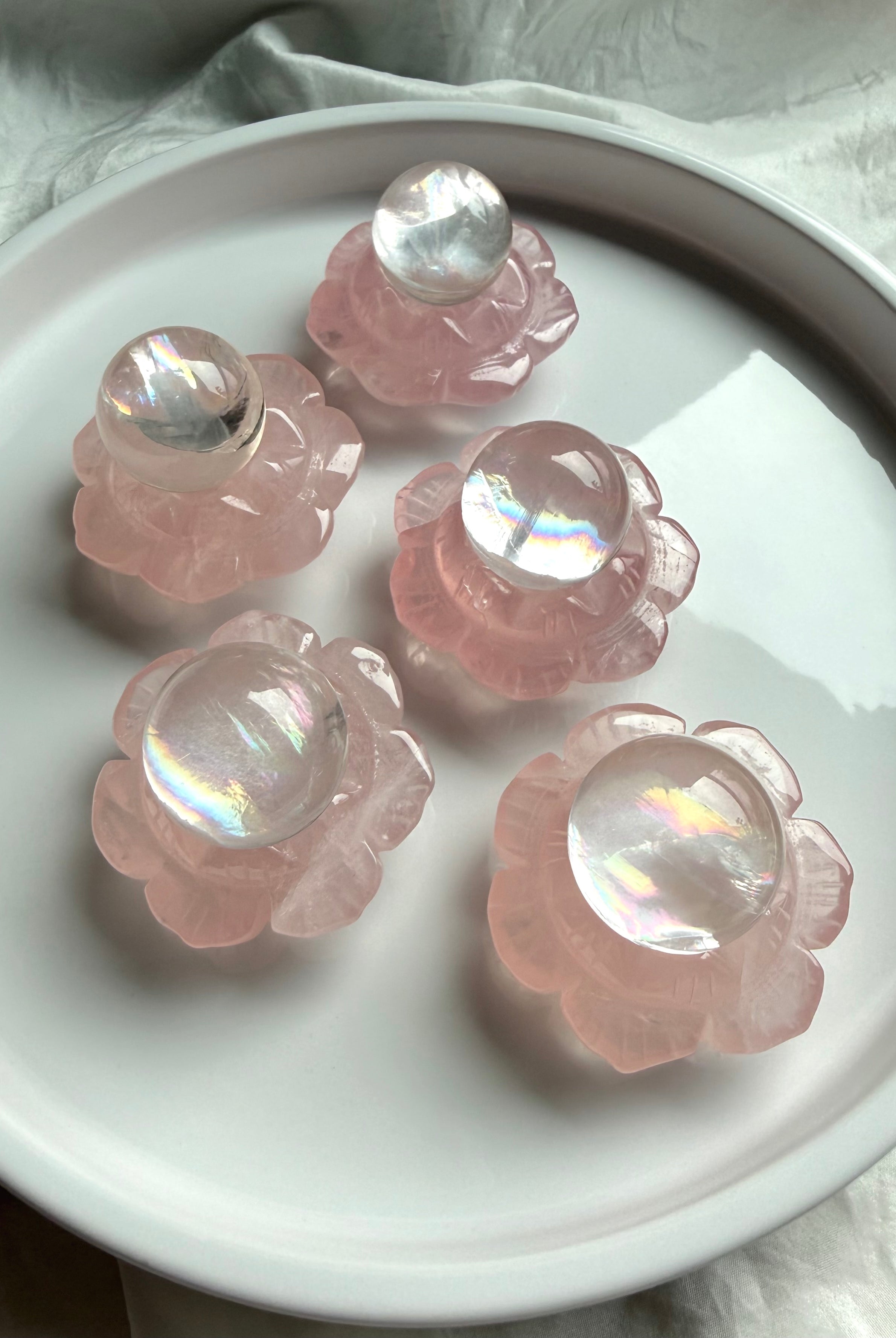 Rose Quartz lotus flower carvings holding mini girasol quartz crystal spheres, heart chakra altar decor