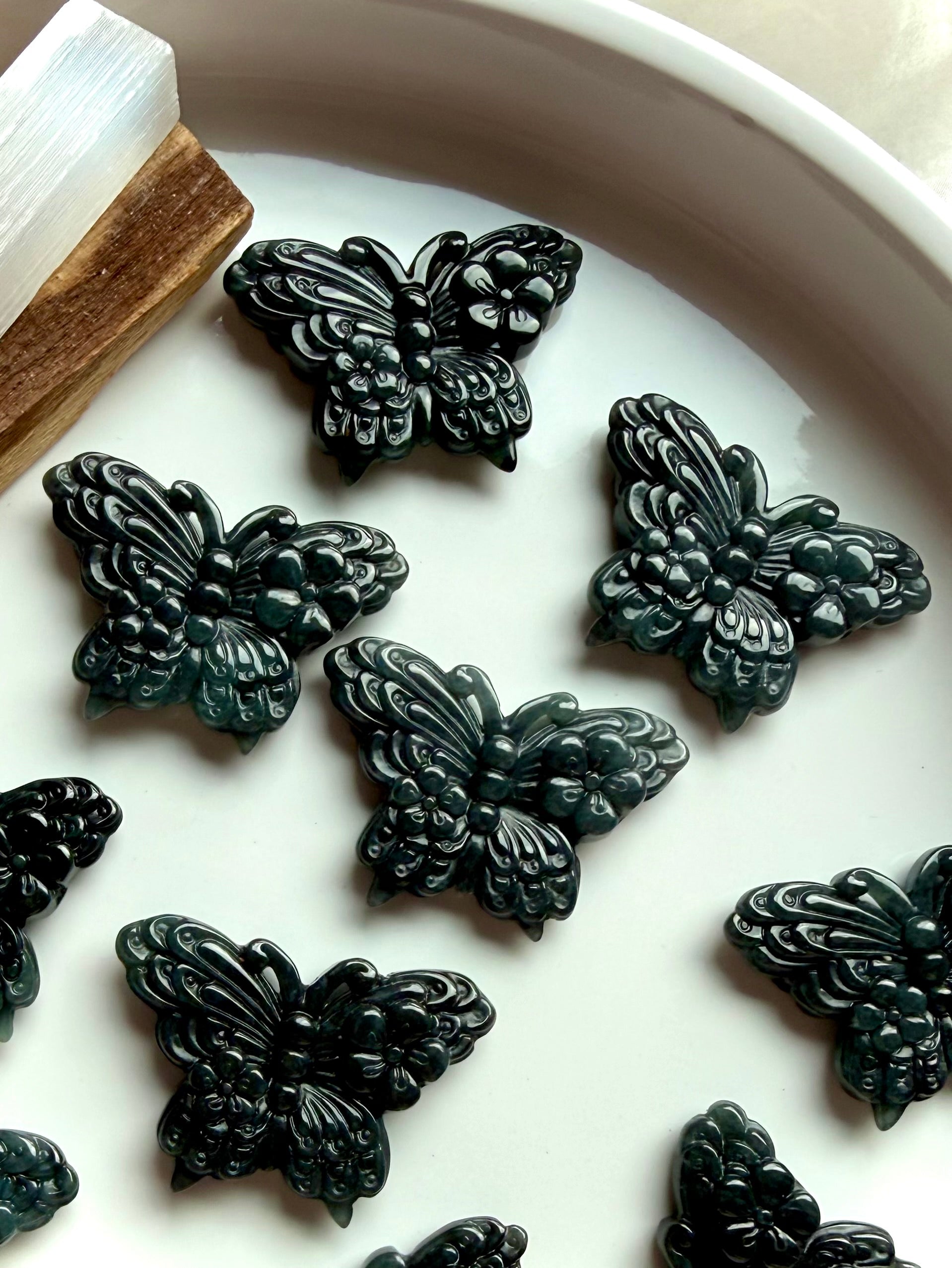 Collection of Wuji jade butterfly carvings in dark green Guatemalan jade crystal