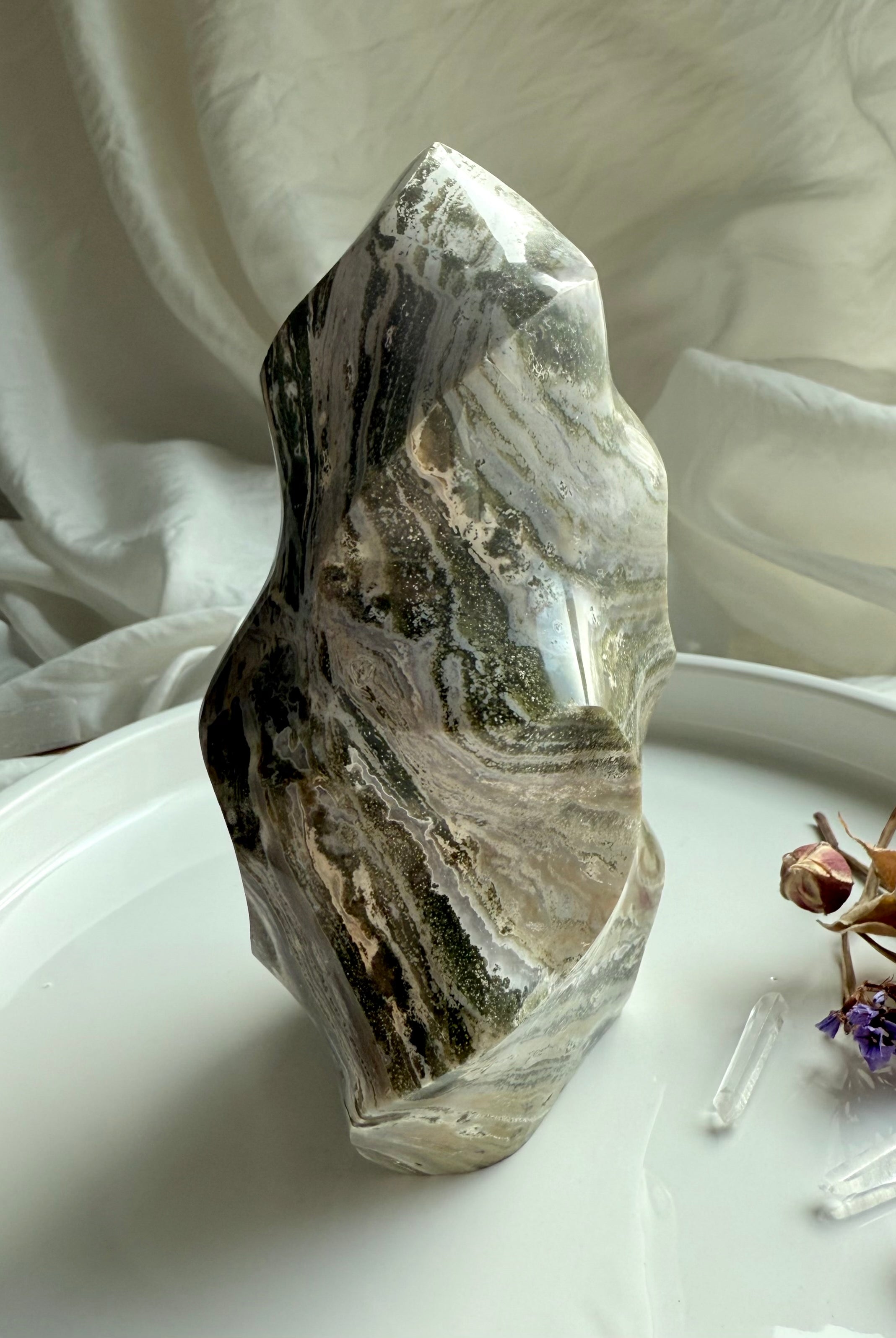 Standing Green Ocean Jasper flame sculpture with flowing Earth-tone striations and smooth carved contours.
