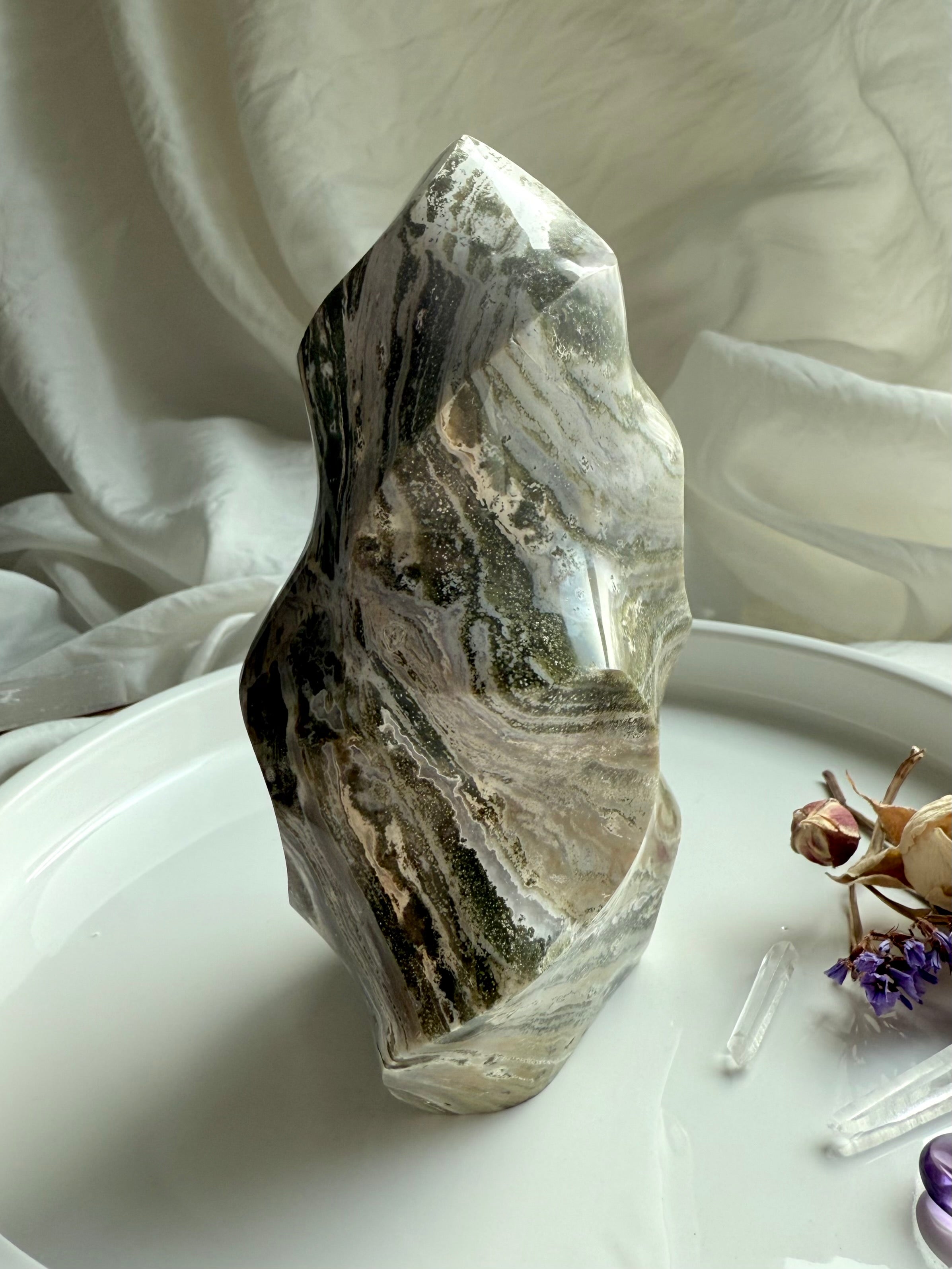 Standing Green Ocean Jasper flame sculpture with flowing Earth-tone striations and smooth carved contours.
