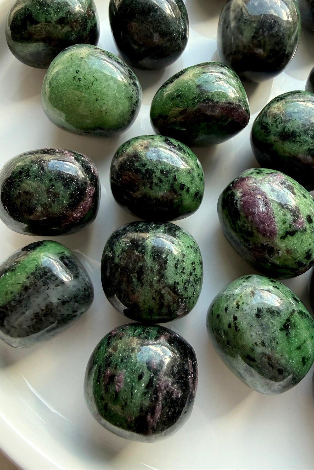 Polished Ruby Zoisite crystals with distinctive green, pink and black mineral patterns, natural Anyolite tumbled gemstones