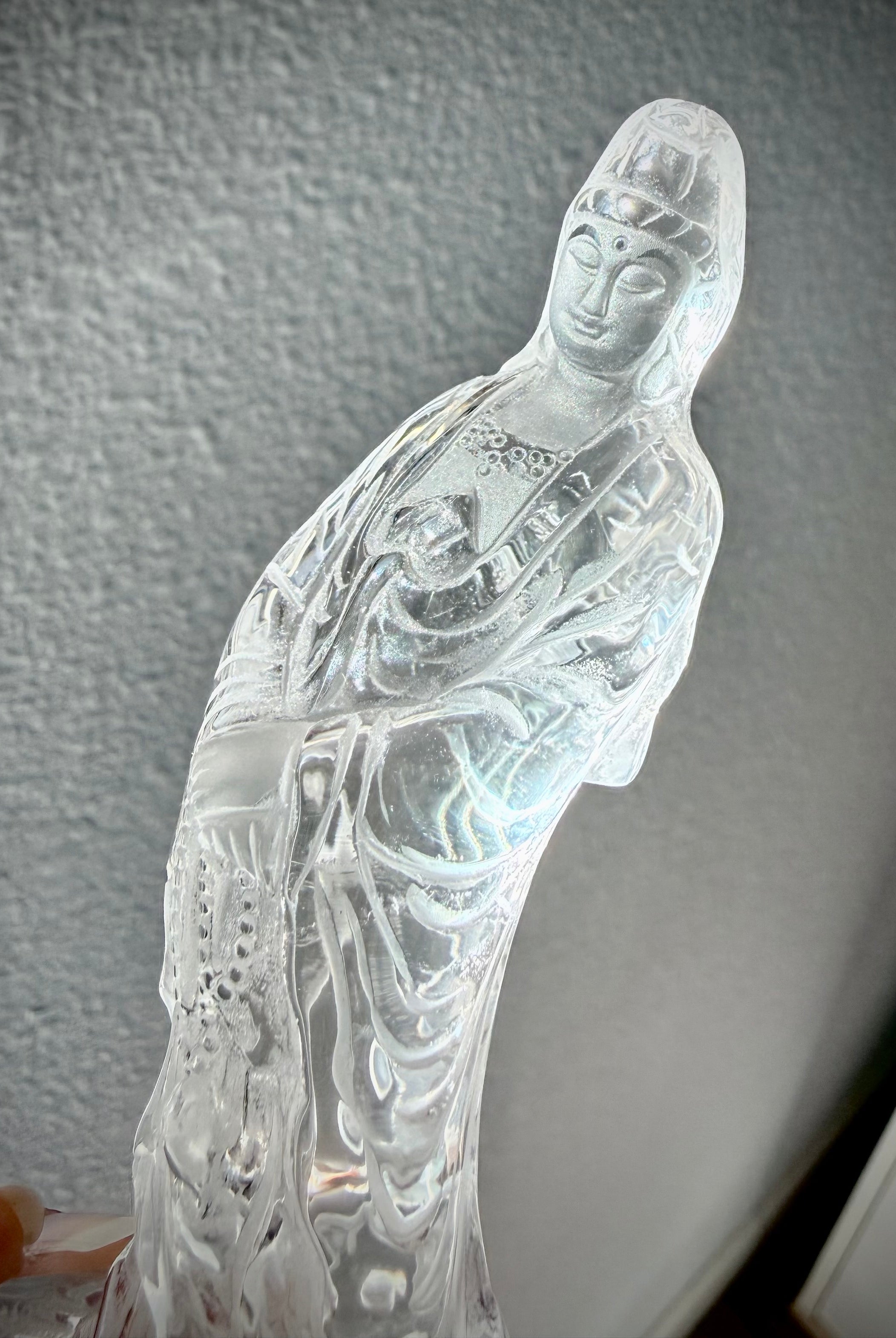 Natural Clear Quartz Quan Yin carving with ethereal light and intricate detail from every angle