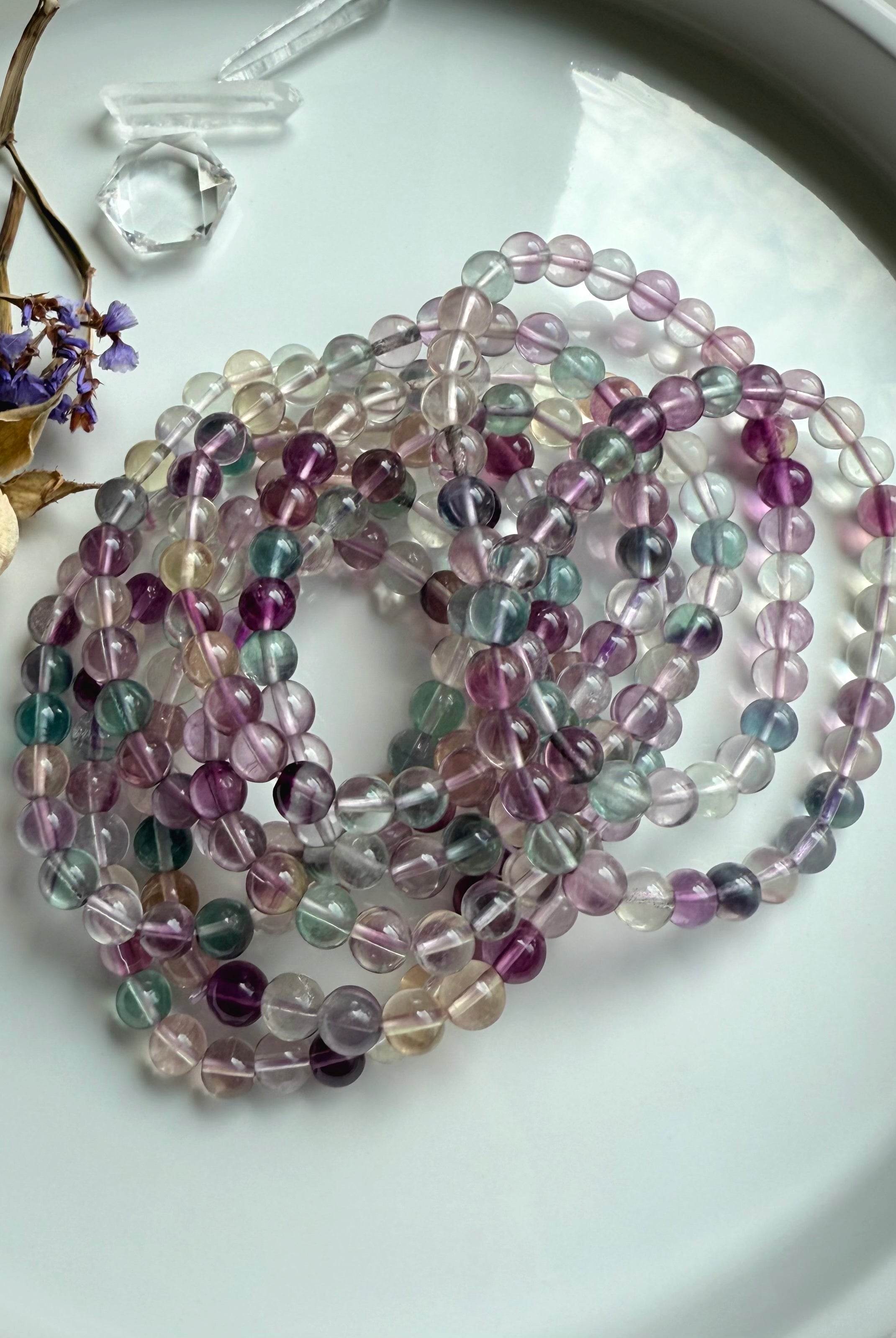 Fluorite beaded bracelet styled with natural crystals to evoke focus, intuition, and mindful energy