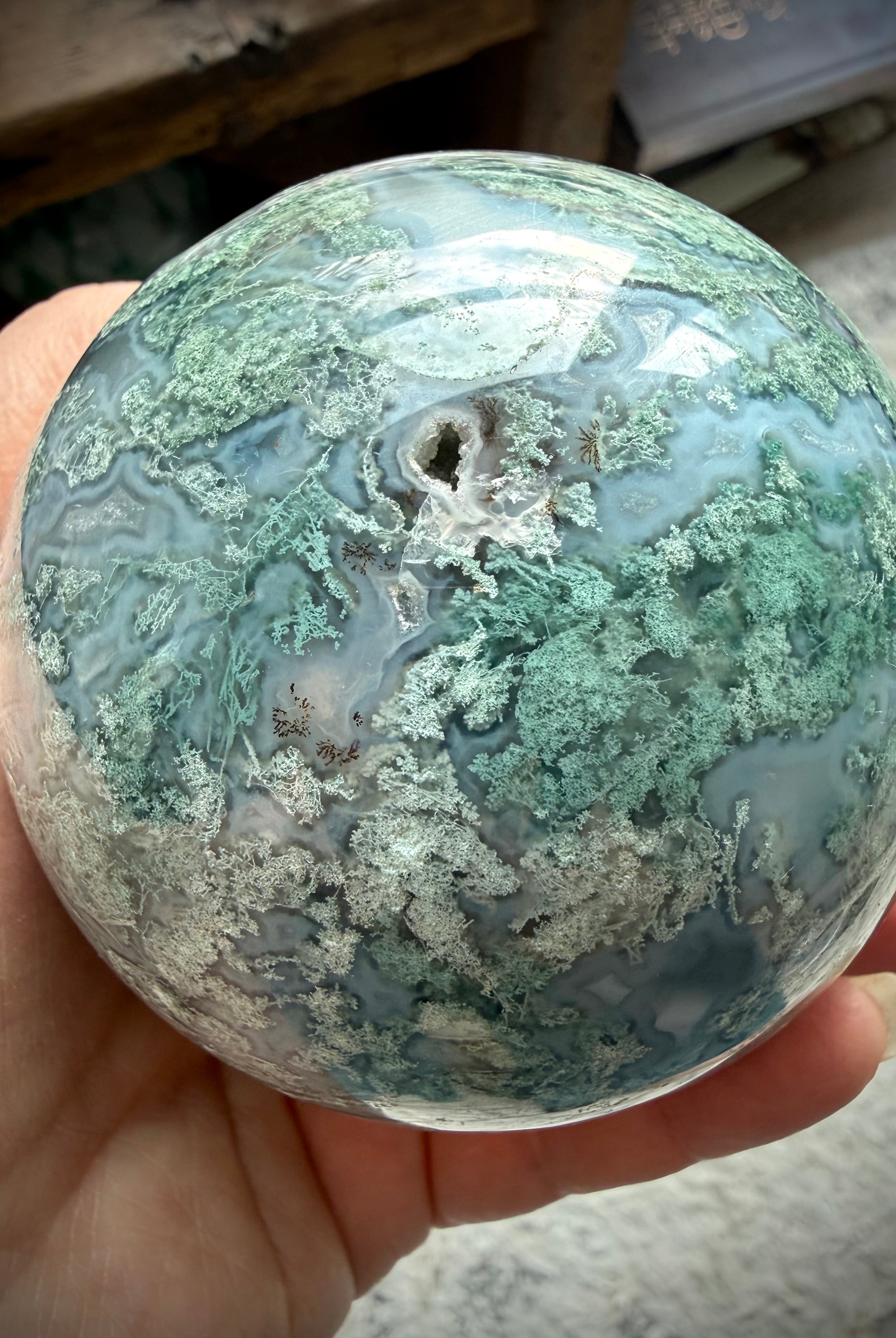 Lacy Moss Agate sphere with Quartz vein, druzy crystal details, and intricate green mineral patterns