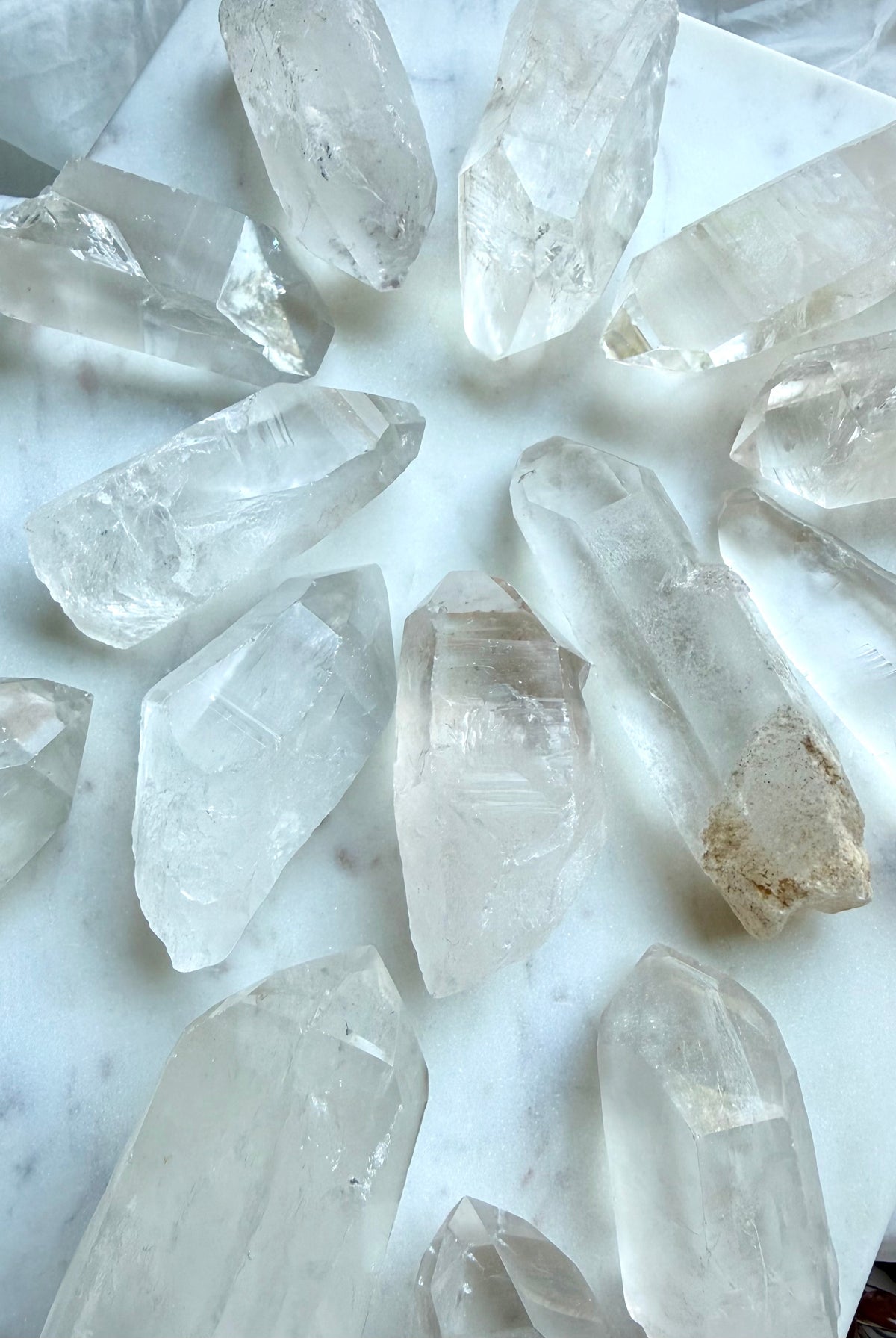 Chunky Lemurian Quartz points from Brazil with natural ladder lines, cloudy inclusions, and varied raw crystal formations