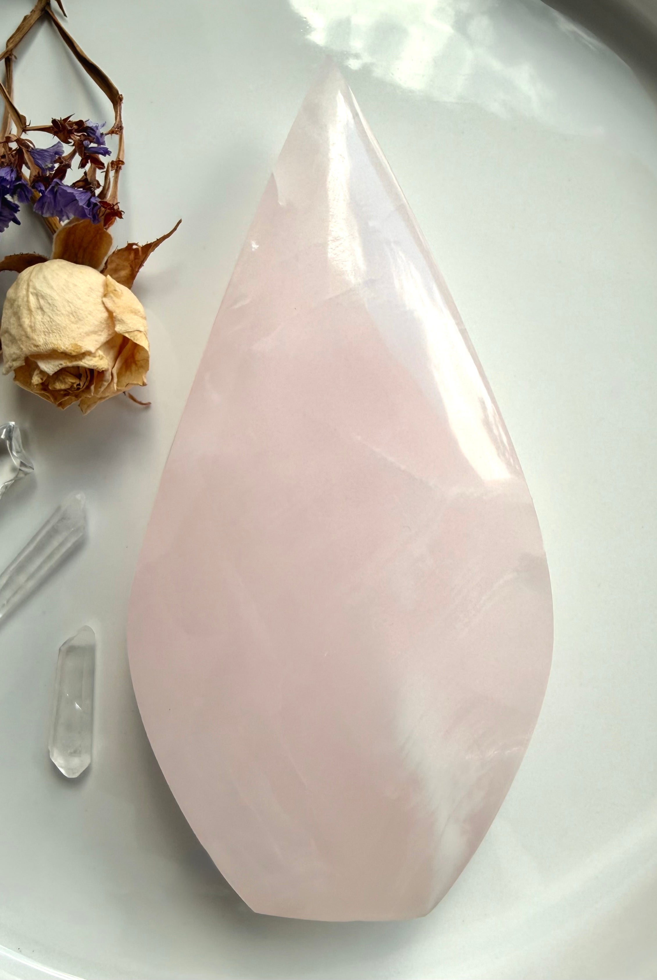 One of a kind Mangano Calcite flame crystal displaying gentle translucency and natural cloud-like internal formations