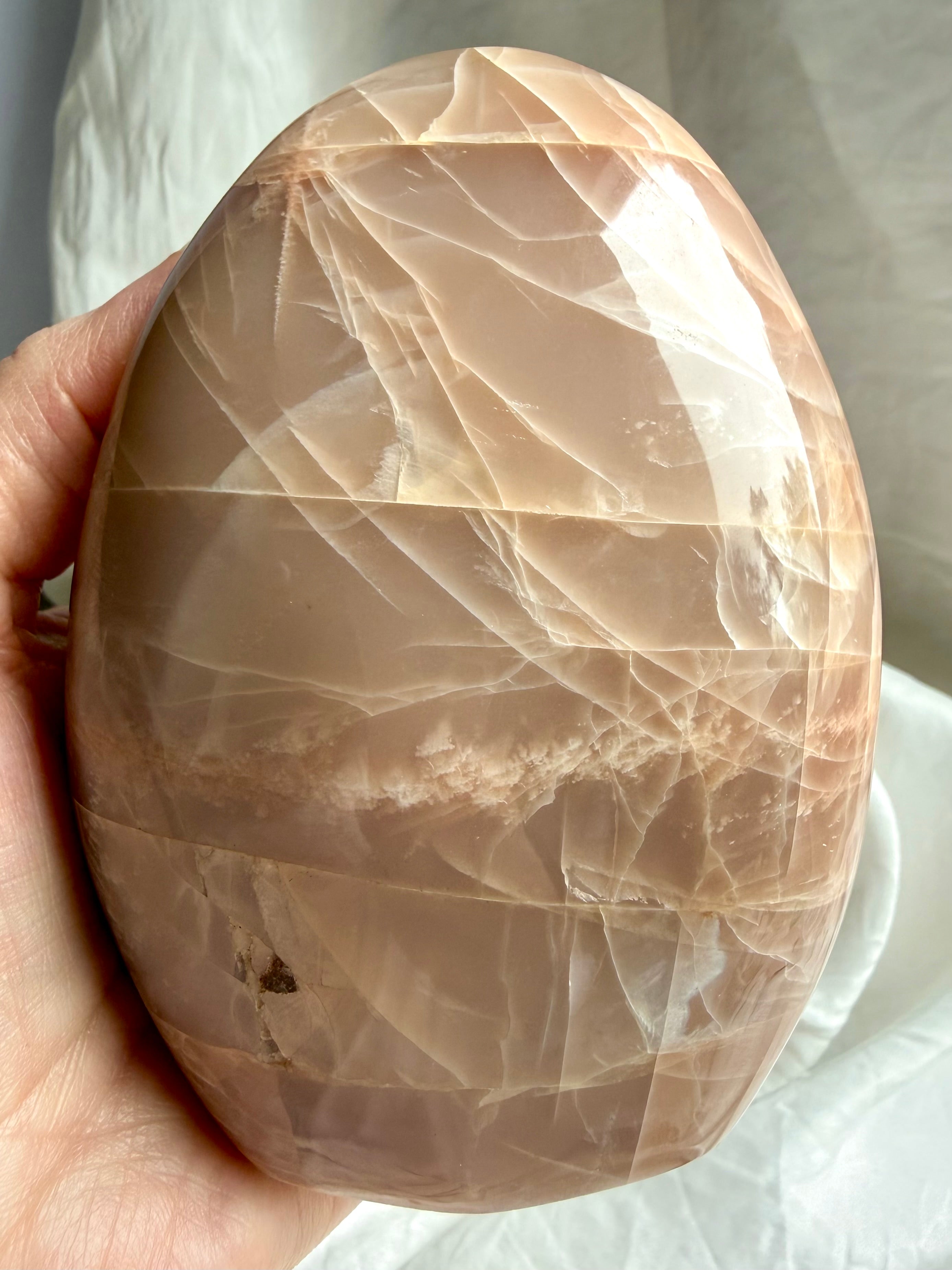 Large Peach Moonstone freeform with layered natural patterns, silvery sheen, and warm peach tones