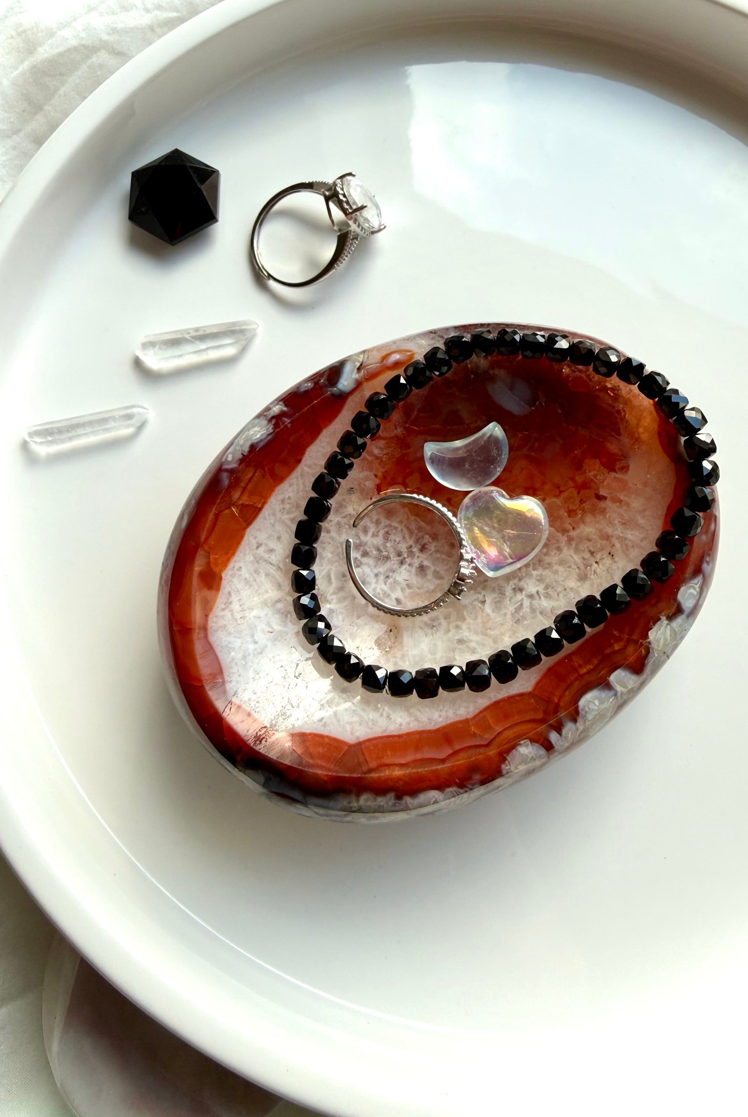 black spinel bracelet styled with carnelian crystal bowl for grounding protection and energy work