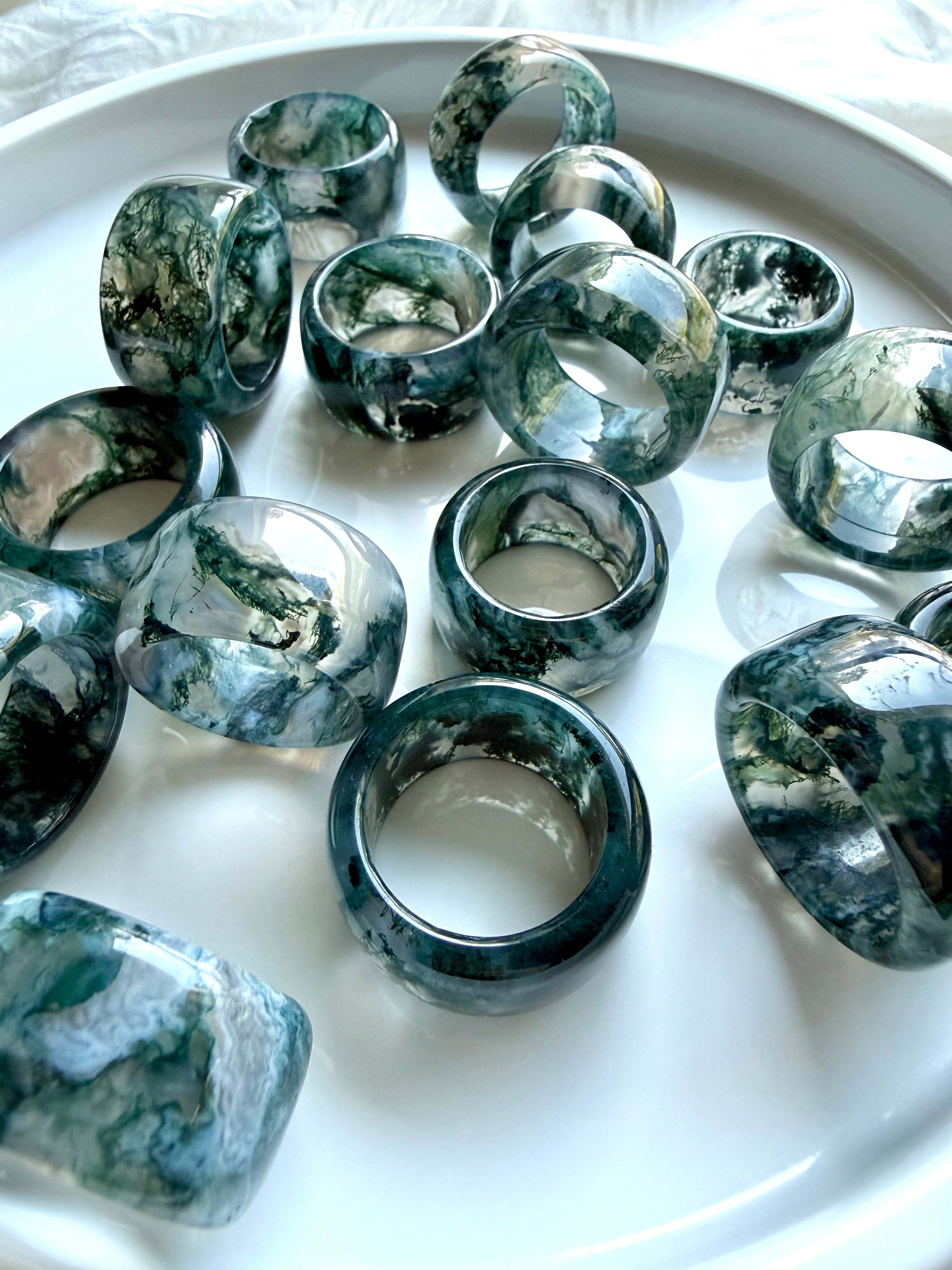chunky translucent moss agate statement rings with scenic green inclusions and glossy rounded band style