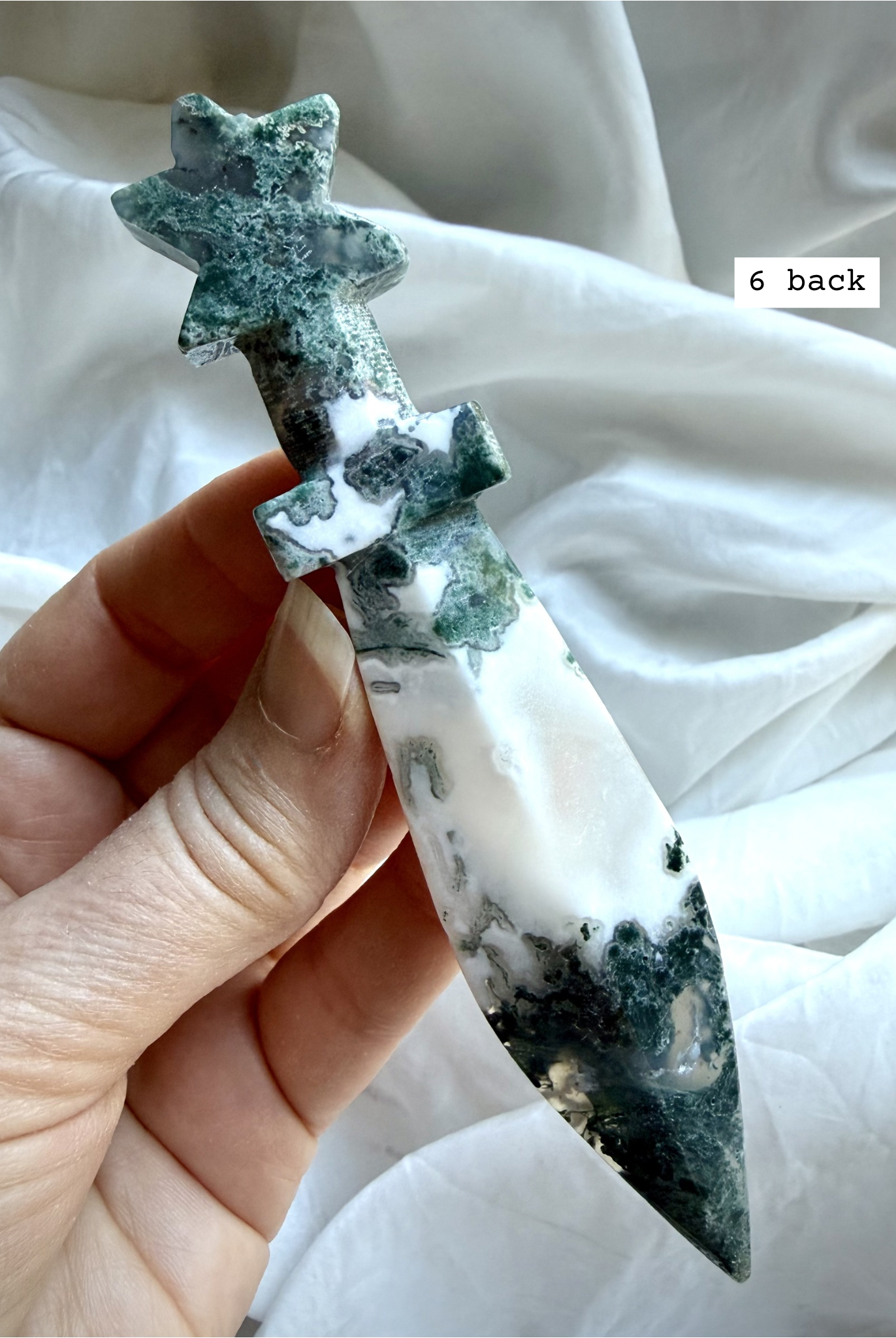 Reverse side of Moss Agate crystal dagger carving with organic moss-like patterning