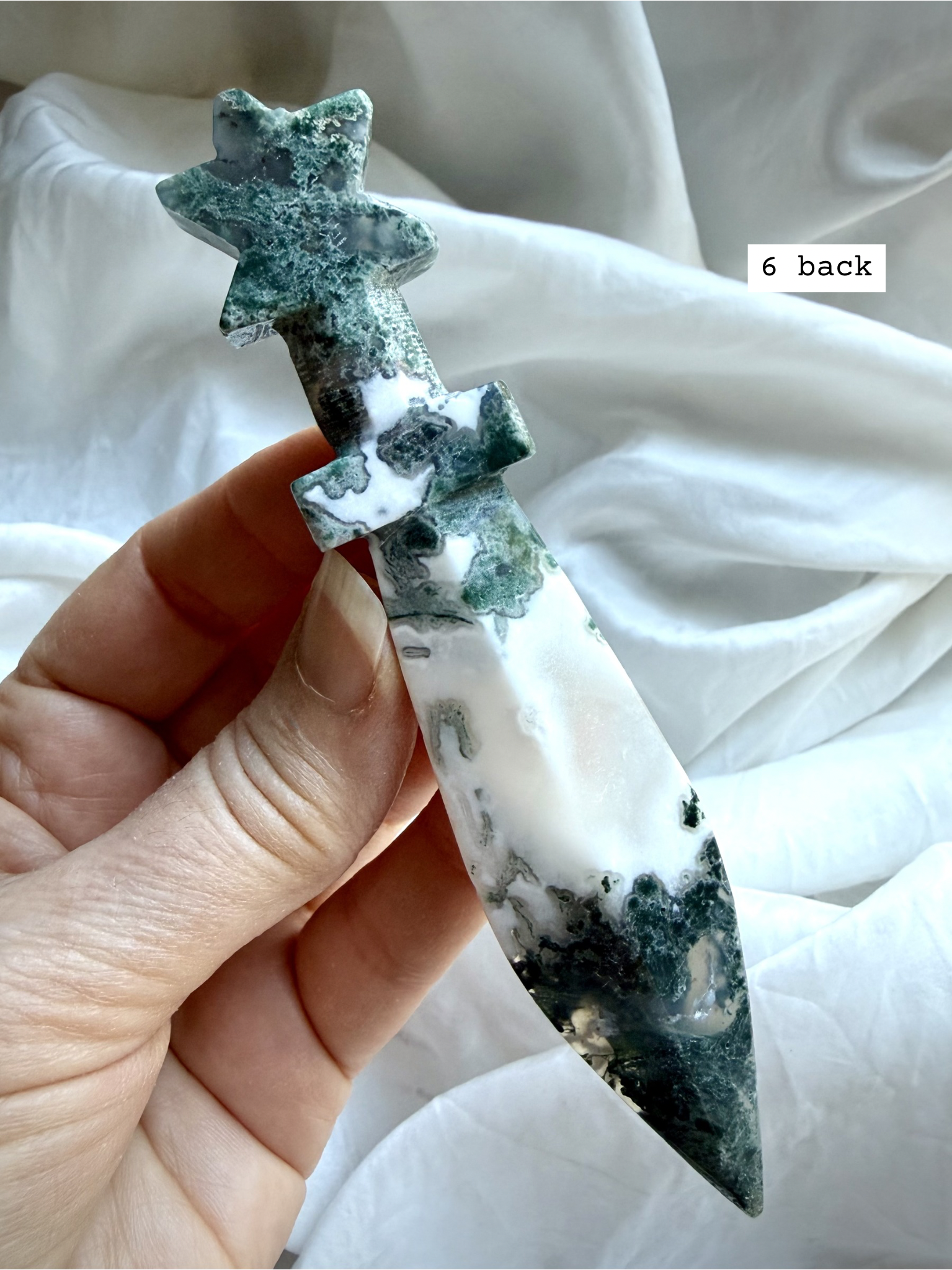 Reverse side of Moss Agate crystal dagger carving with organic moss-like patterning