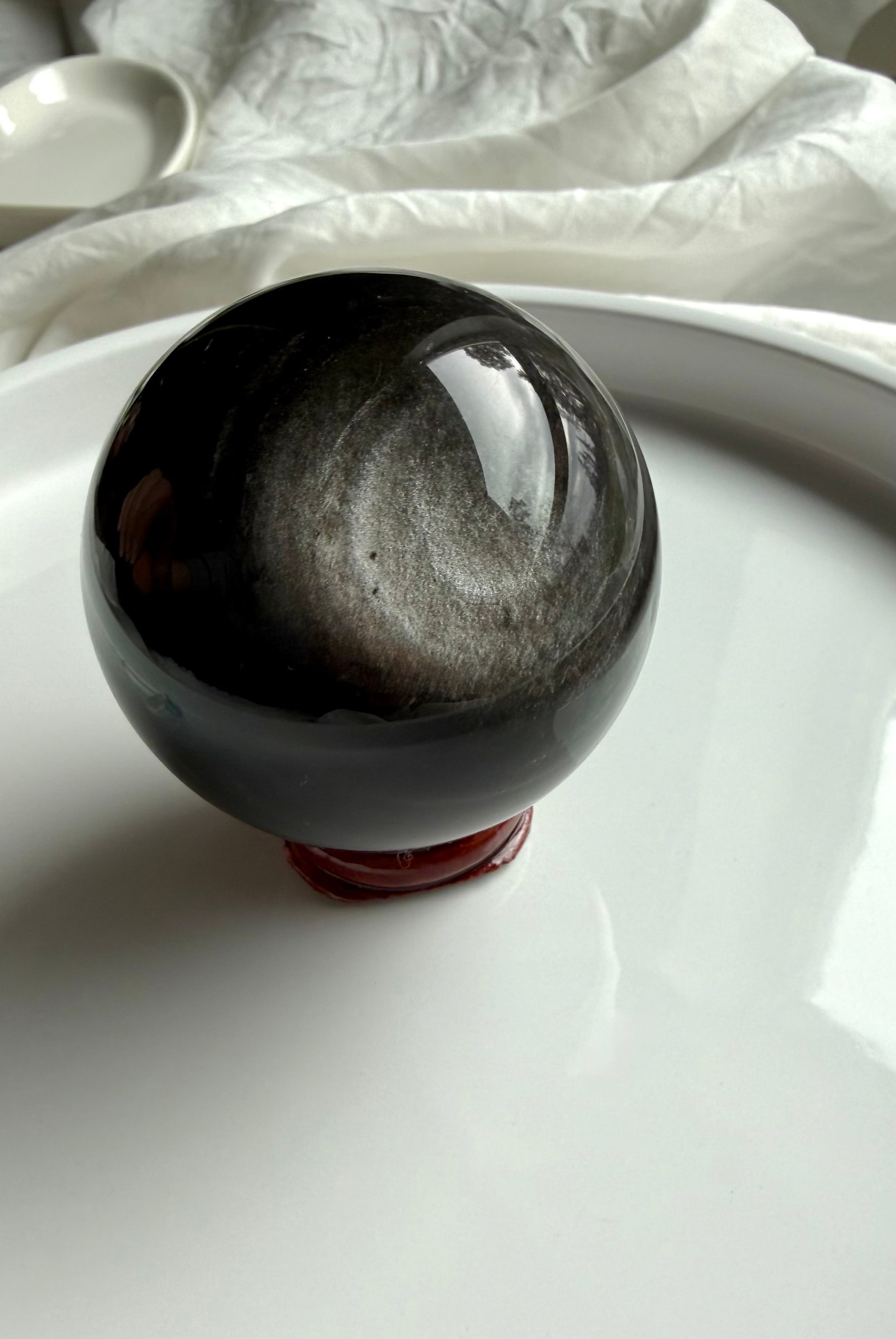 Silver Sheen Obsidian crystal sphere on stand — powerful altar stone for grounding, protection, and clarity