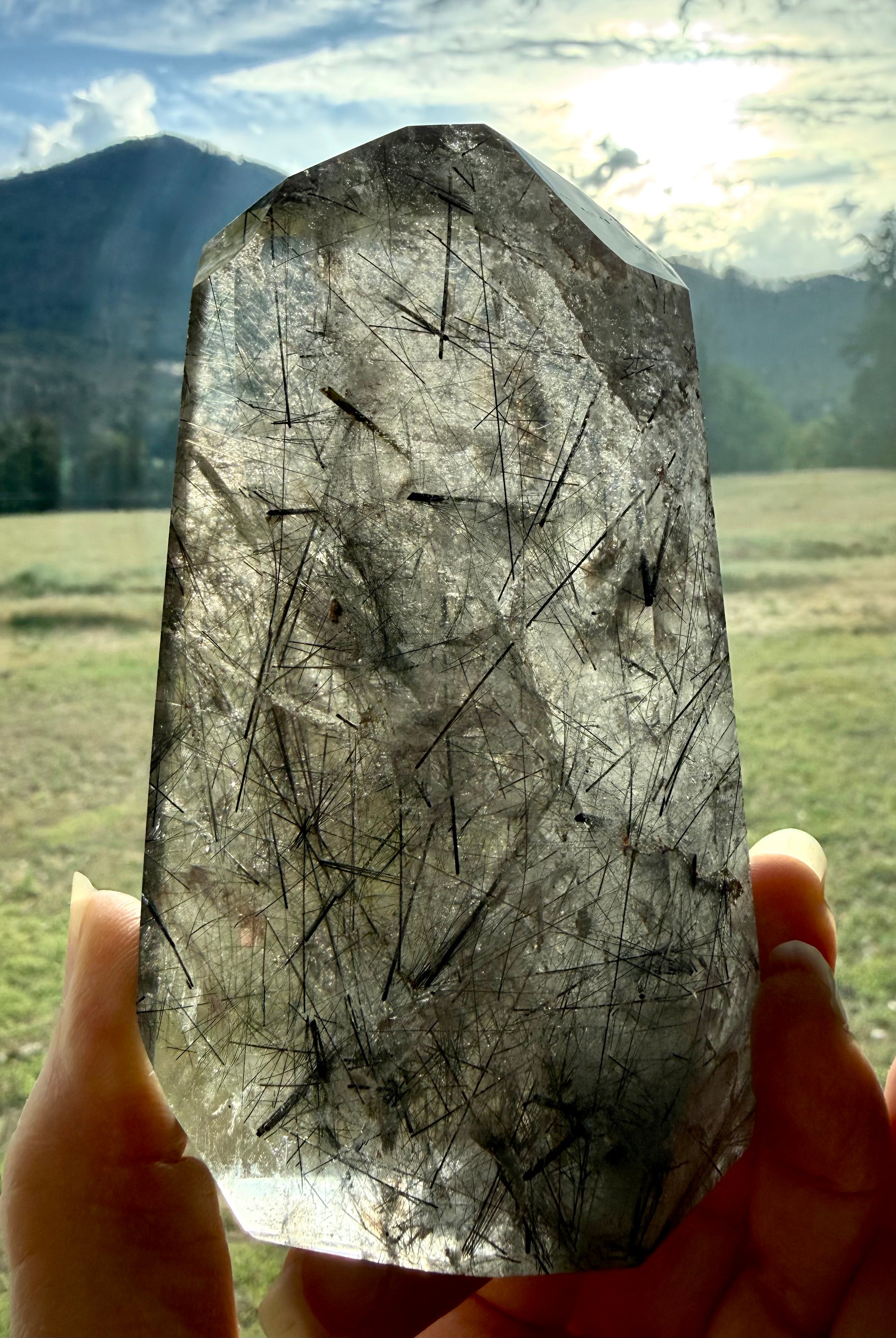 Large Black Tourmaline in Quartz crystal tower with natural needle inclusions and polished faceted shape
