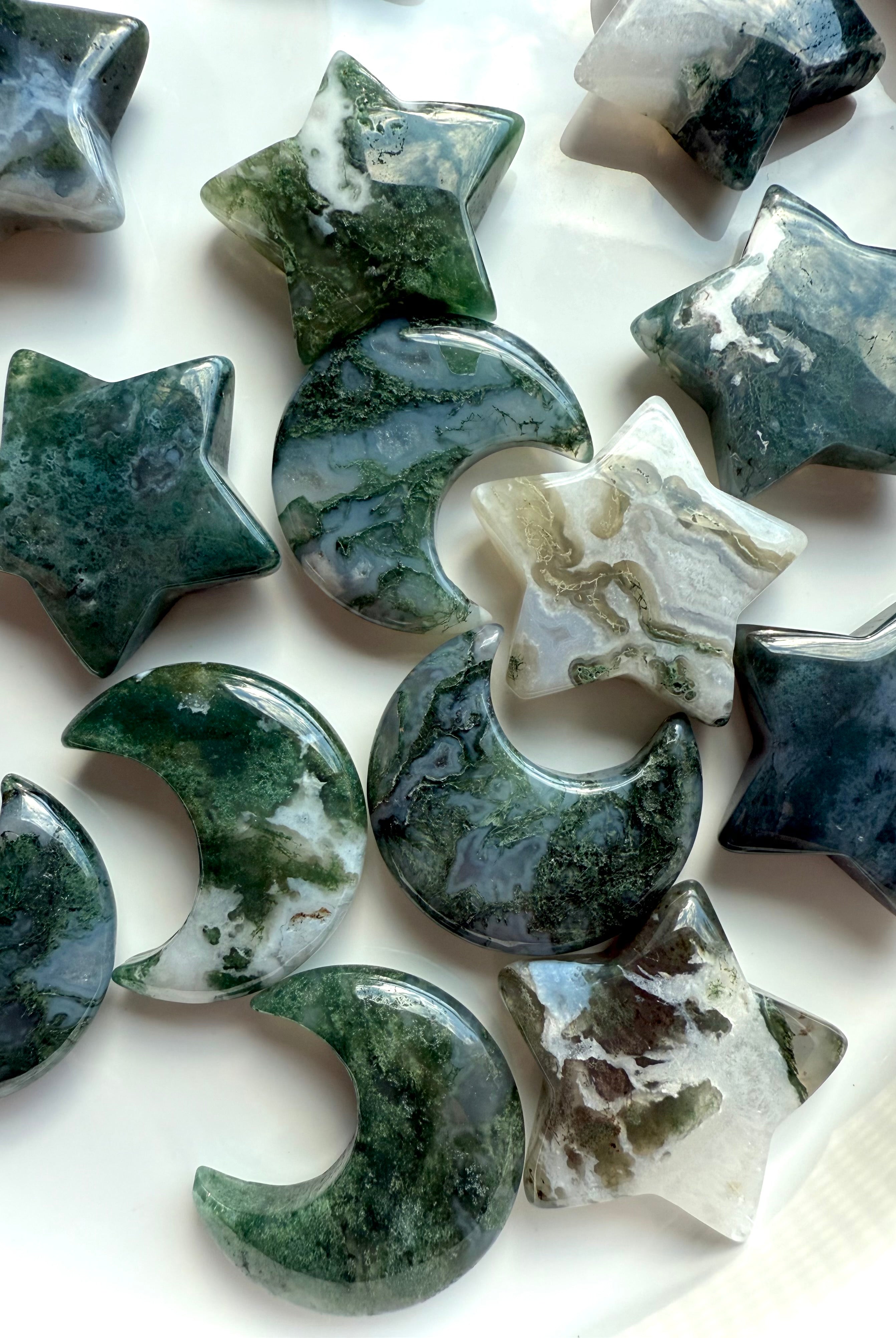 Close-up of Moss Agate moons and stars showing intricate moss-like inclusions and natural banding — heart chakra healing crystals for grounding and emotional renewal.