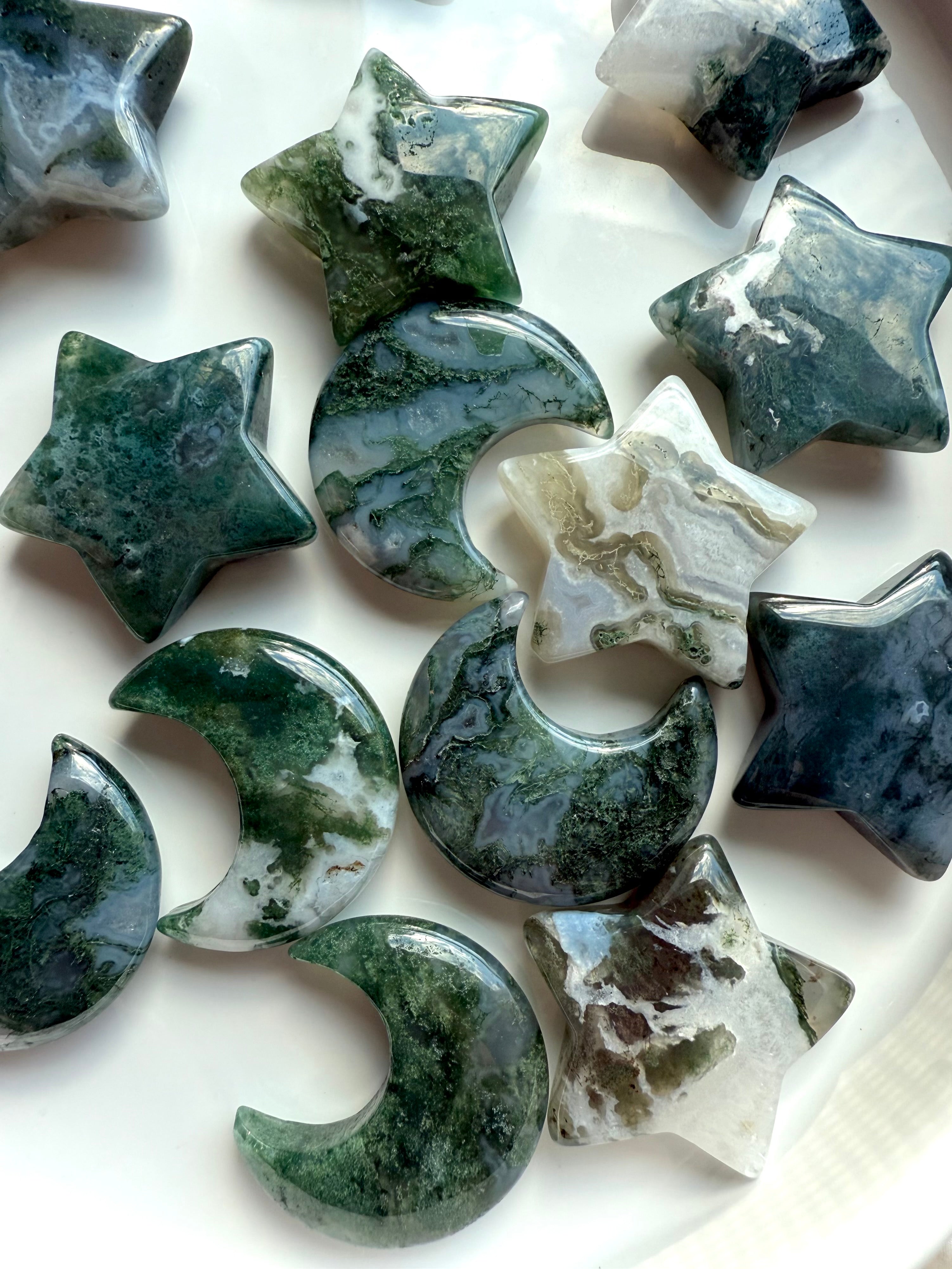 Close-up of Moss Agate moons and stars showing intricate moss-like inclusions and natural banding — heart chakra healing crystals for grounding and emotional renewal.