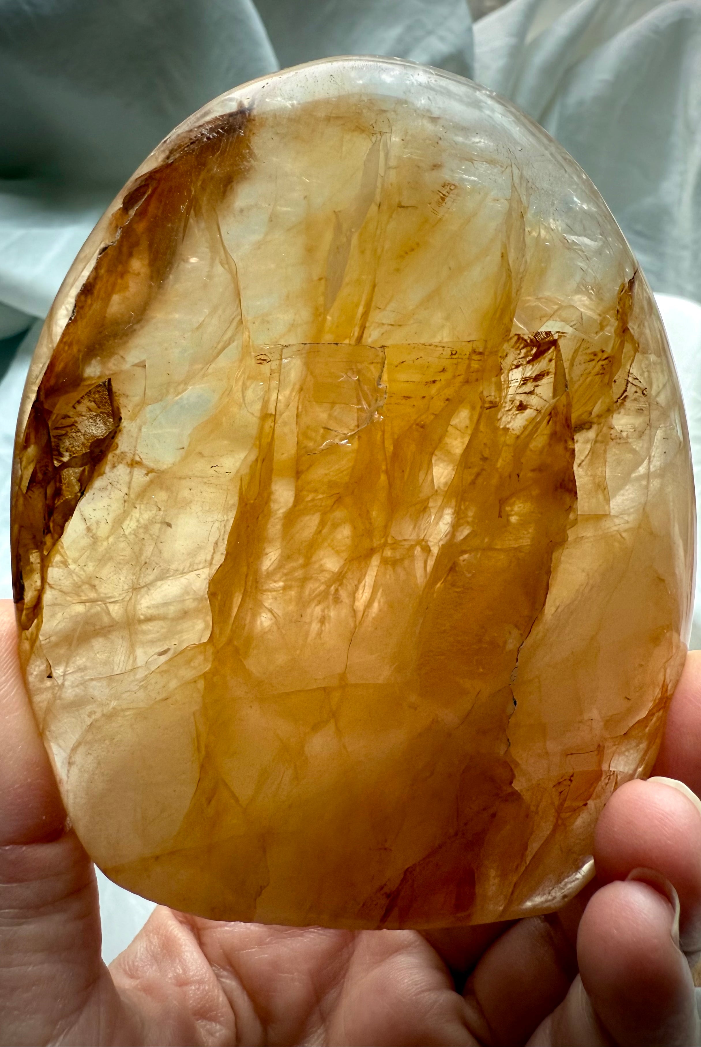 High-quality Golden Healer Quartz freeform stone with radiant golden healing energy and polished finish