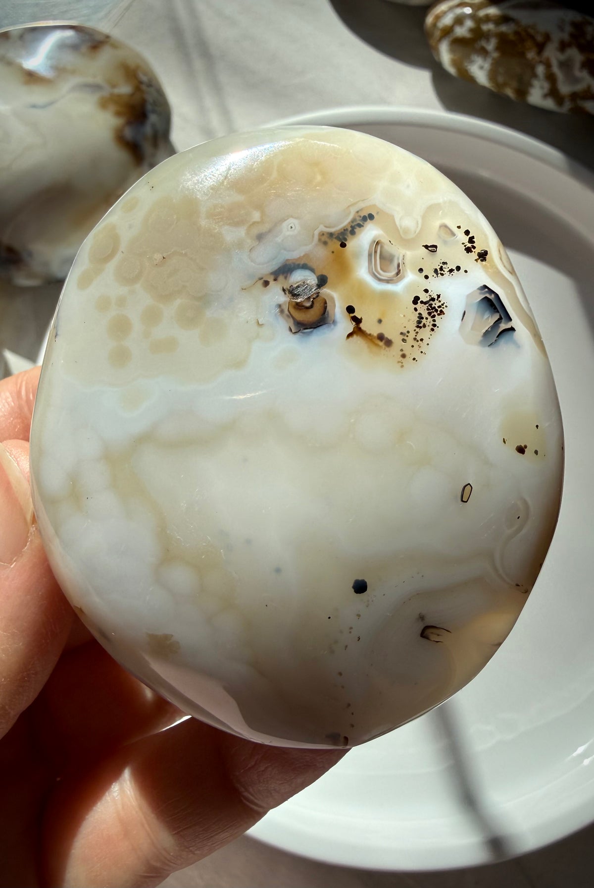 Natural Dendritic Agate freeform with soft honey-colored banding, delicate mineral inclusions and smooth rounded edges