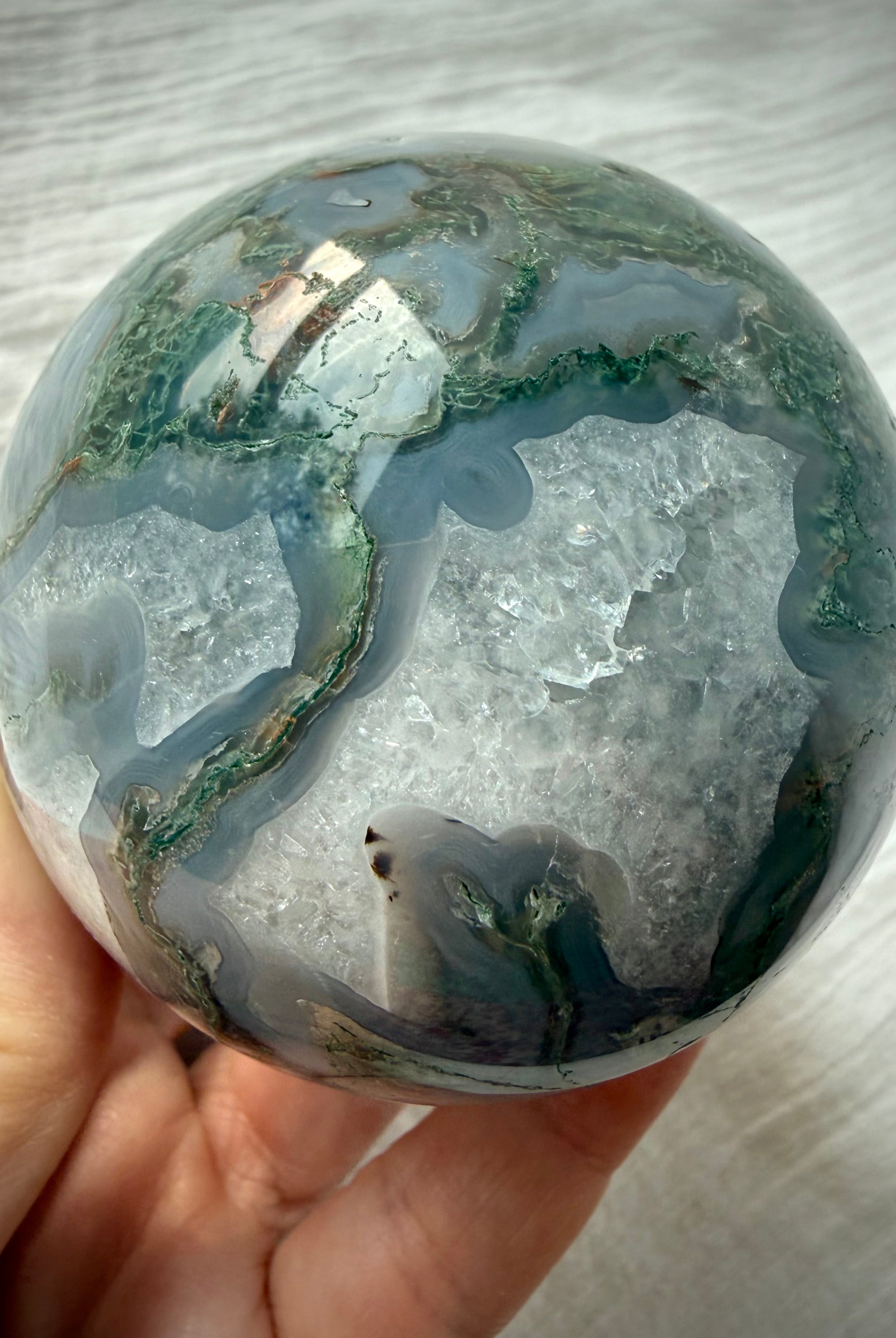 Dendritic Moss Agate crystal ball with sweeping green moss inclusions, gray chalcedony banding and polished finish