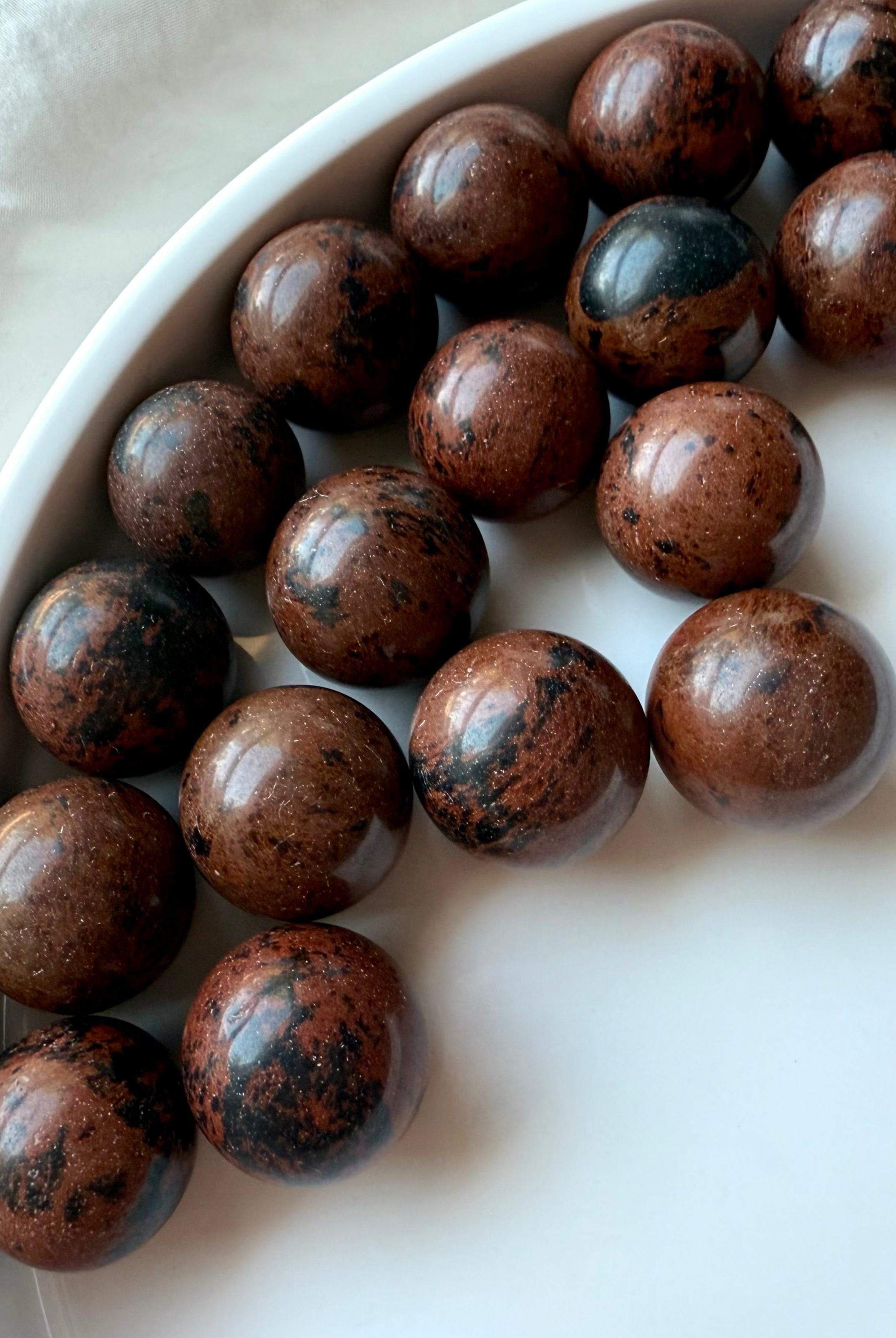 Mahogany Obsidian mini spheres with brown and black patterns – root and sacral chakra crystals for protection and strength
