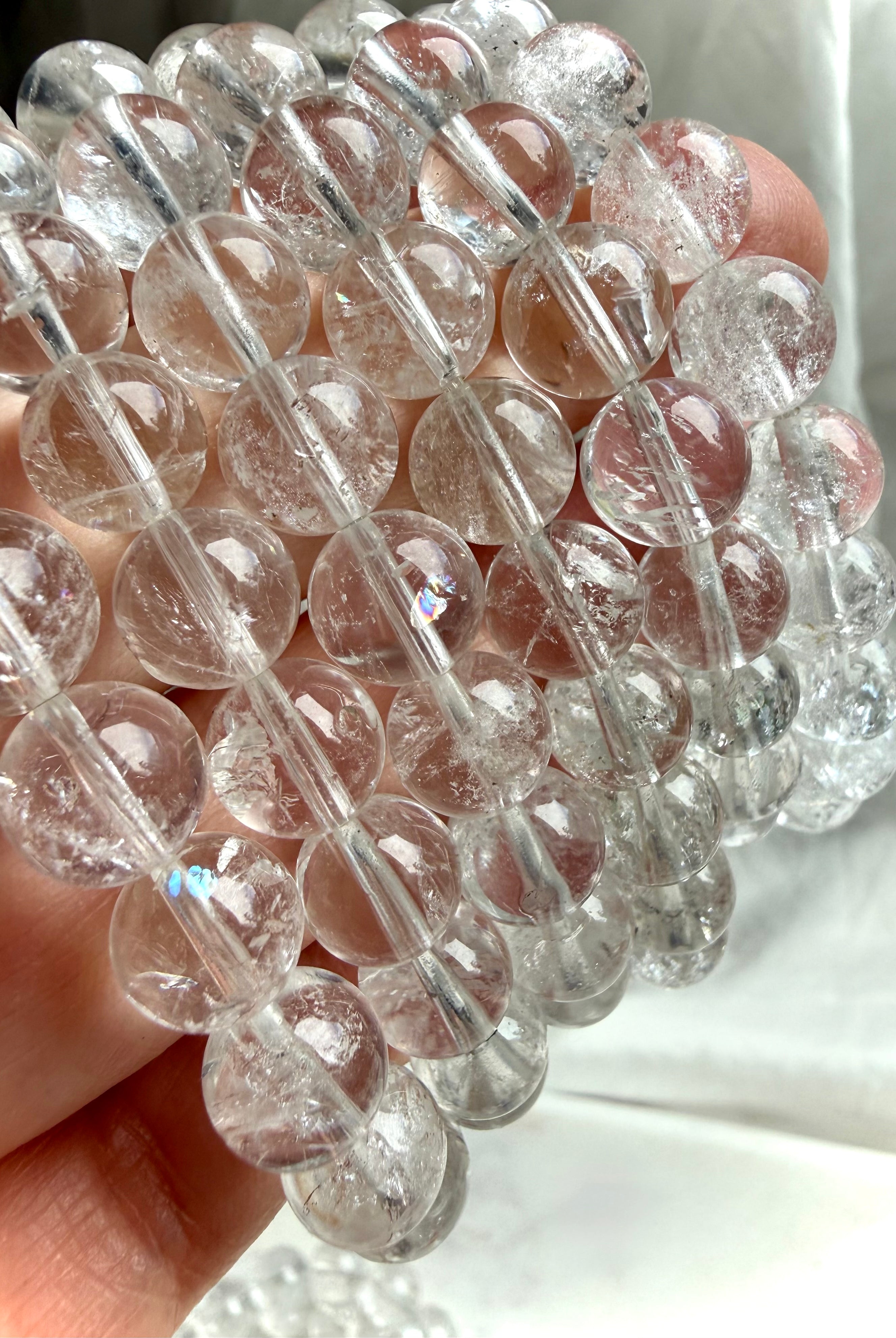 Clear Quartz bead bracelet with soft rainbow flashes for chakra healing and energetic cleansing